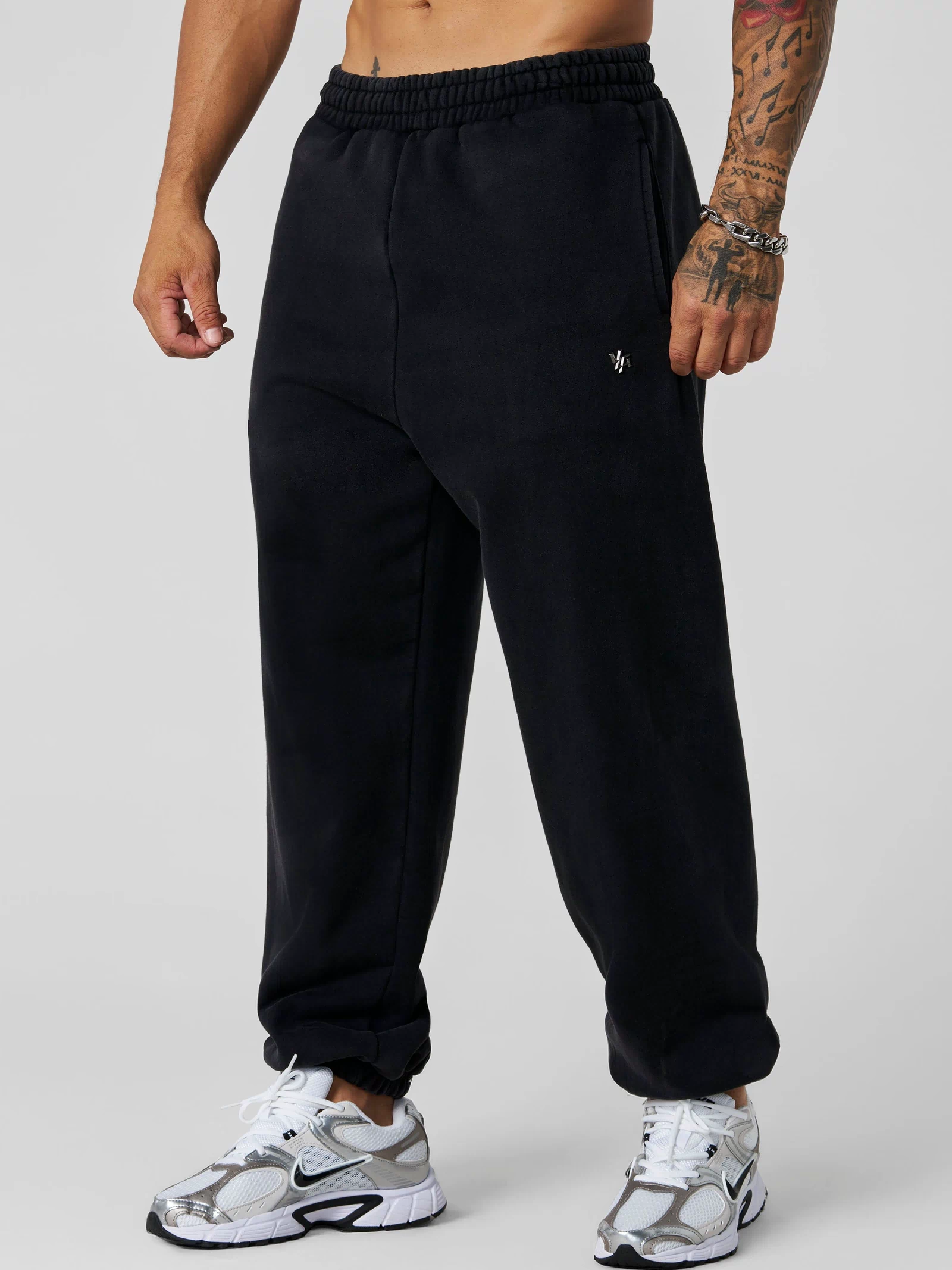 2069 - Elevated Essentials - Baggy Joggers — oversized, comfortable fit with cuffed ankles, structured heavyweight cotton, and subtle “Elevated” branding for a premium, versatile look in Black Wash