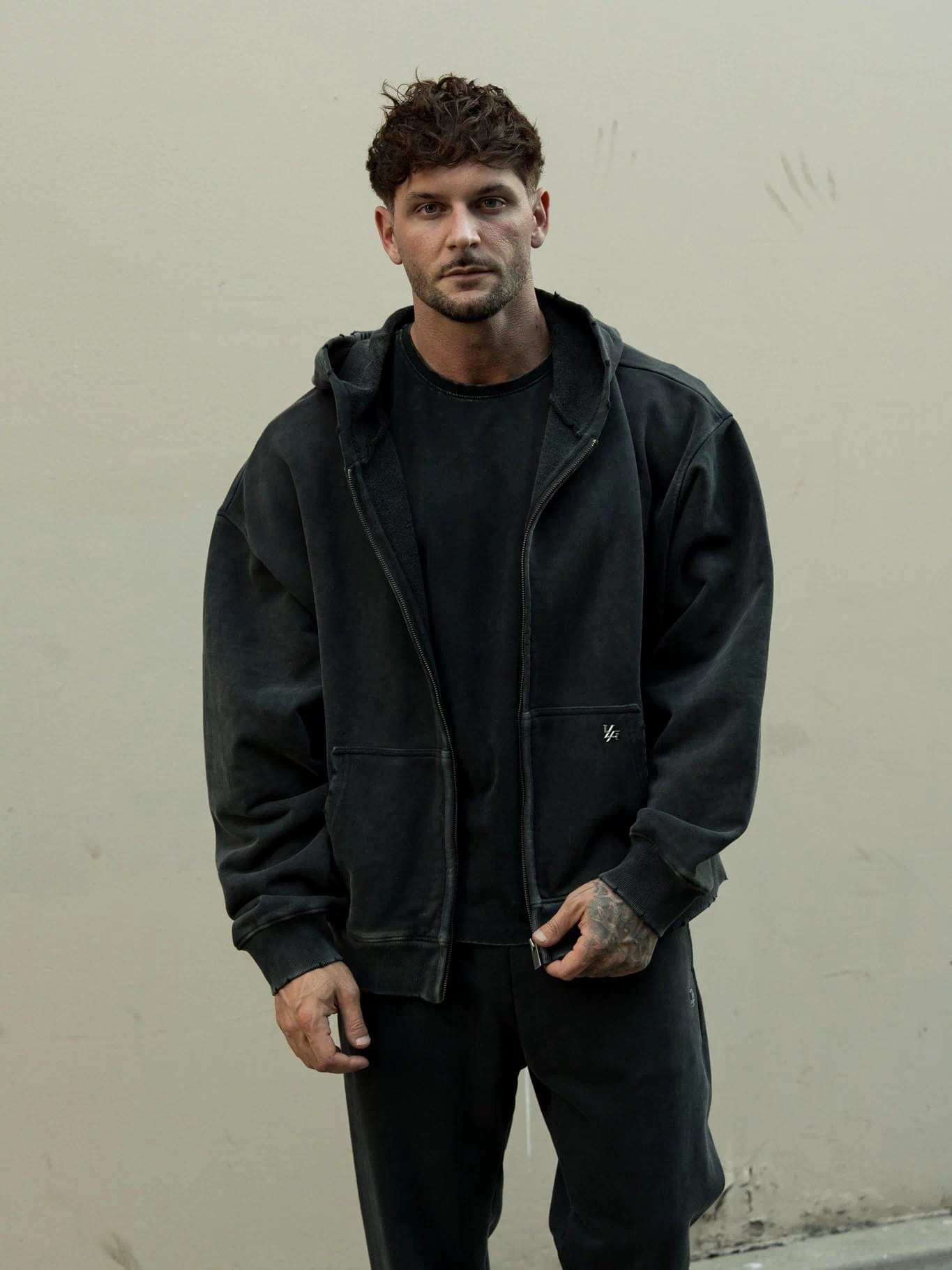 5102 - Elevated Essentials - Zip-Ups - Full-zip heavyweight terry cotton hoodie with front pockets, ribbed finishes, smooth zipper, and minimal 'Elevated' print in colour Black Wash.