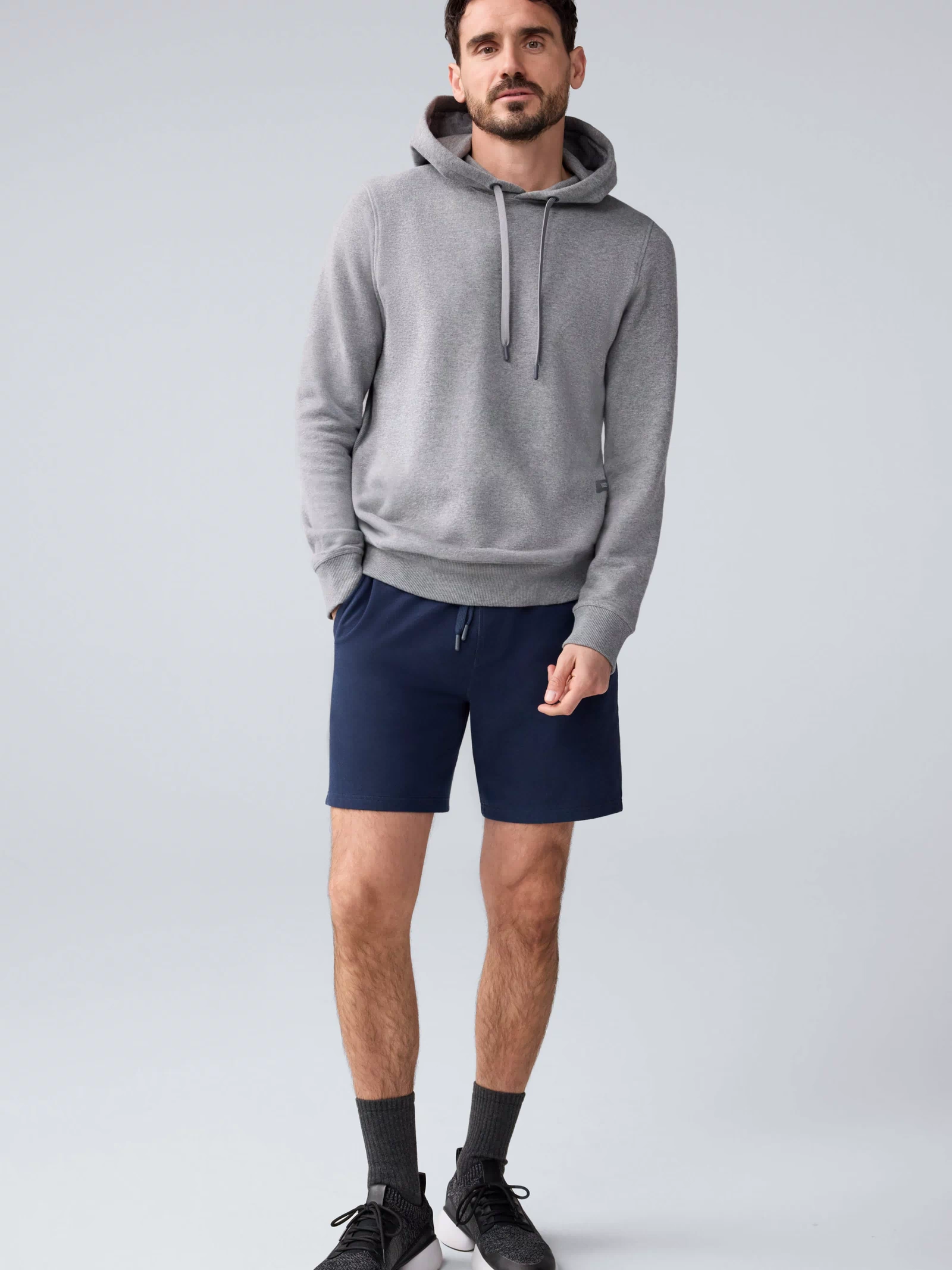 Full view of a man wearing ACE Sweatshort 7” in Total Eclipse