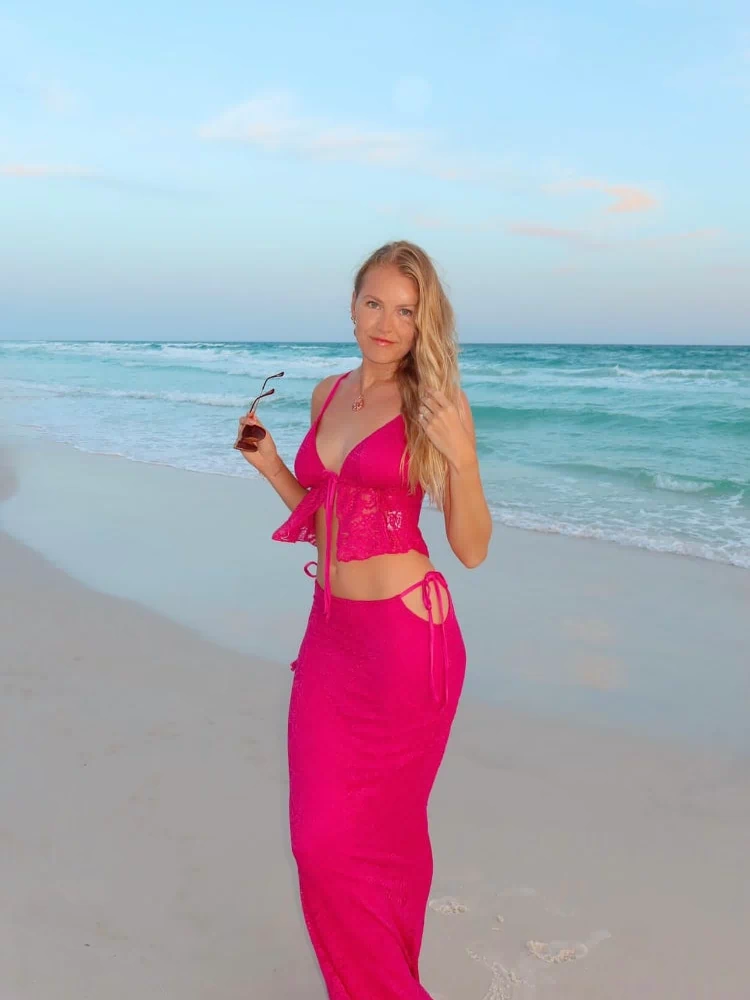 Fuschia lace maxi skirt with side tie-up waist cutouts and a fitted silhouette