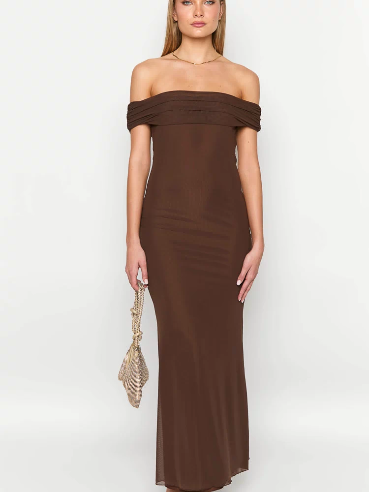 Front view of a brown off-shoulder maxi dress with a ruched neckline, ribbed knit body, and sheer overlay skirt