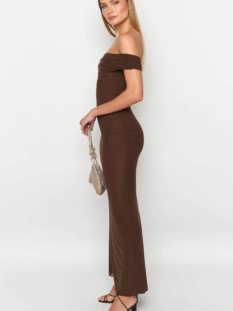 Side view of a brown off-shoulder maxi dress with ruched detailing on the sleeves and a bodycon fit