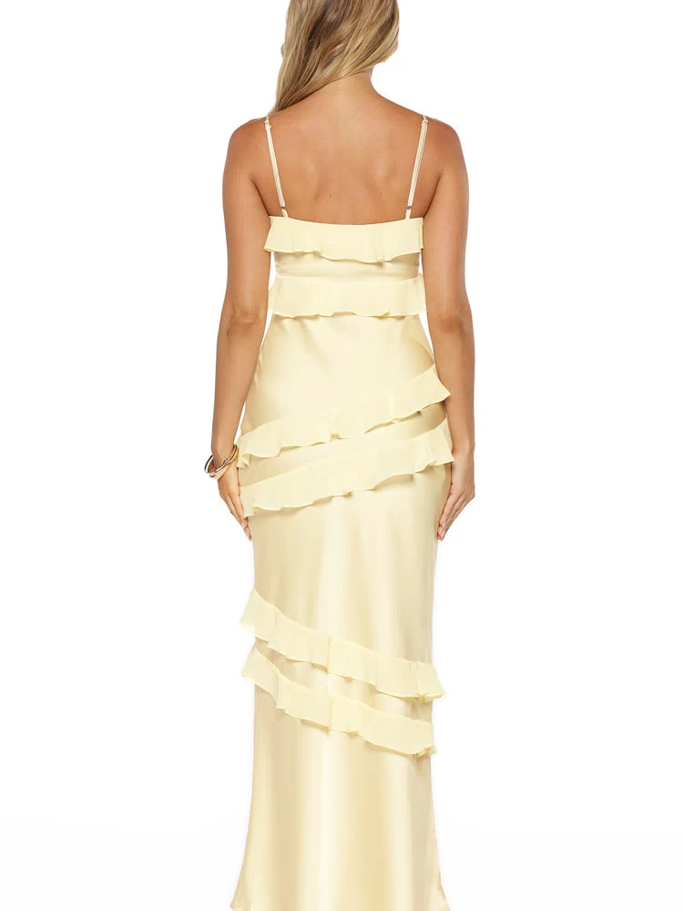 Rear view of a yellow satin maxi dress with tiered ruffles and thin spaghetti straps