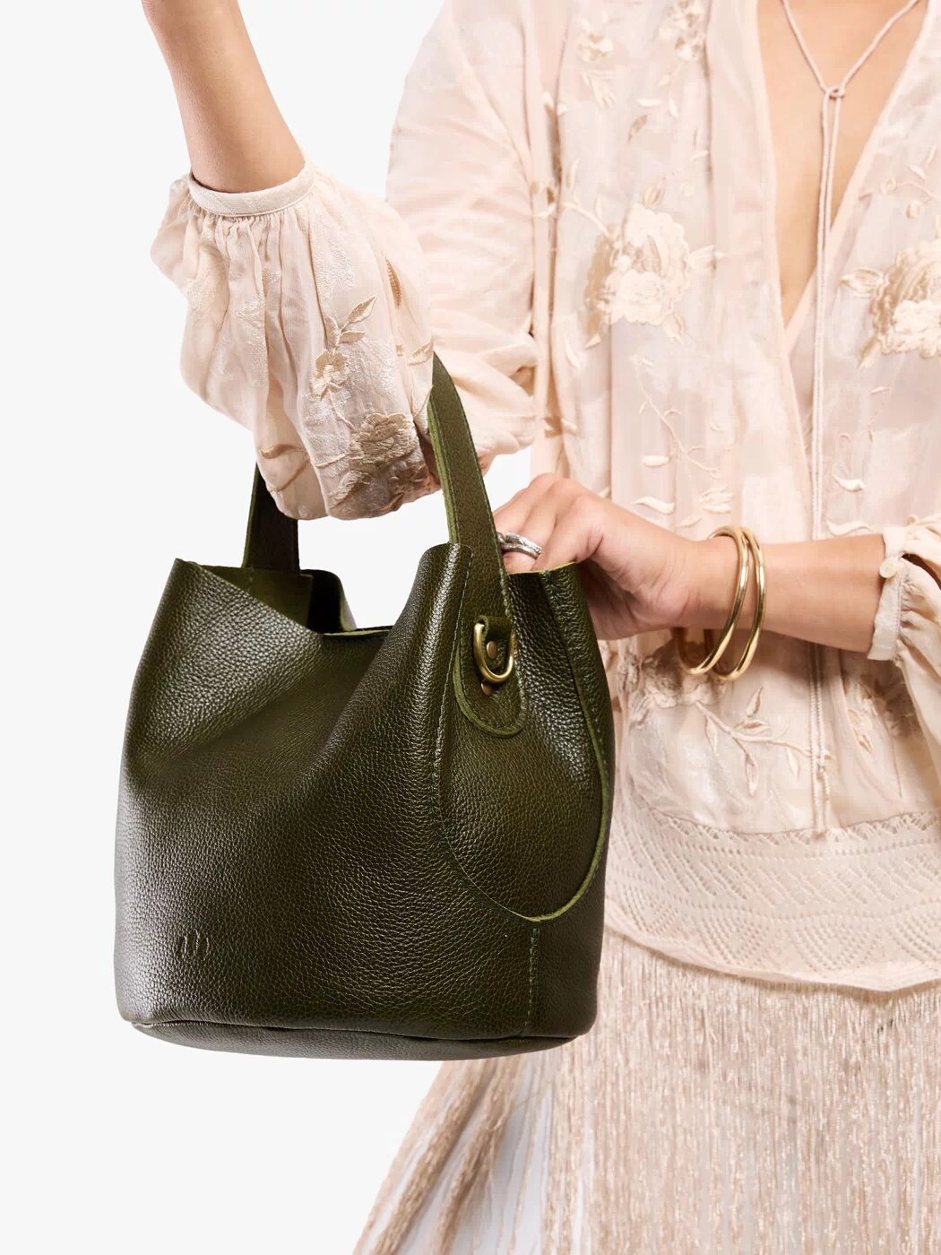 Pebbled Olive*Large | Model carrying symmetrical bucket bag with handle, latch closure, and removable crossbody strap