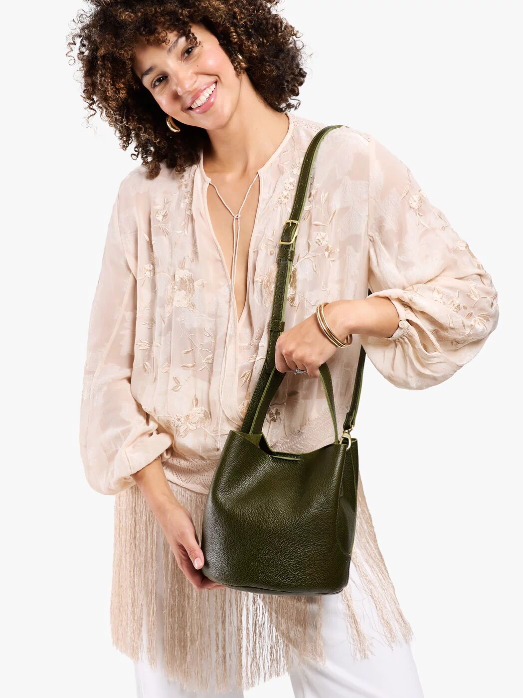 Pebbled Olive*Large | Model carrying symmetrical bucket bag with handle, latch closure, and removable crossbody strap