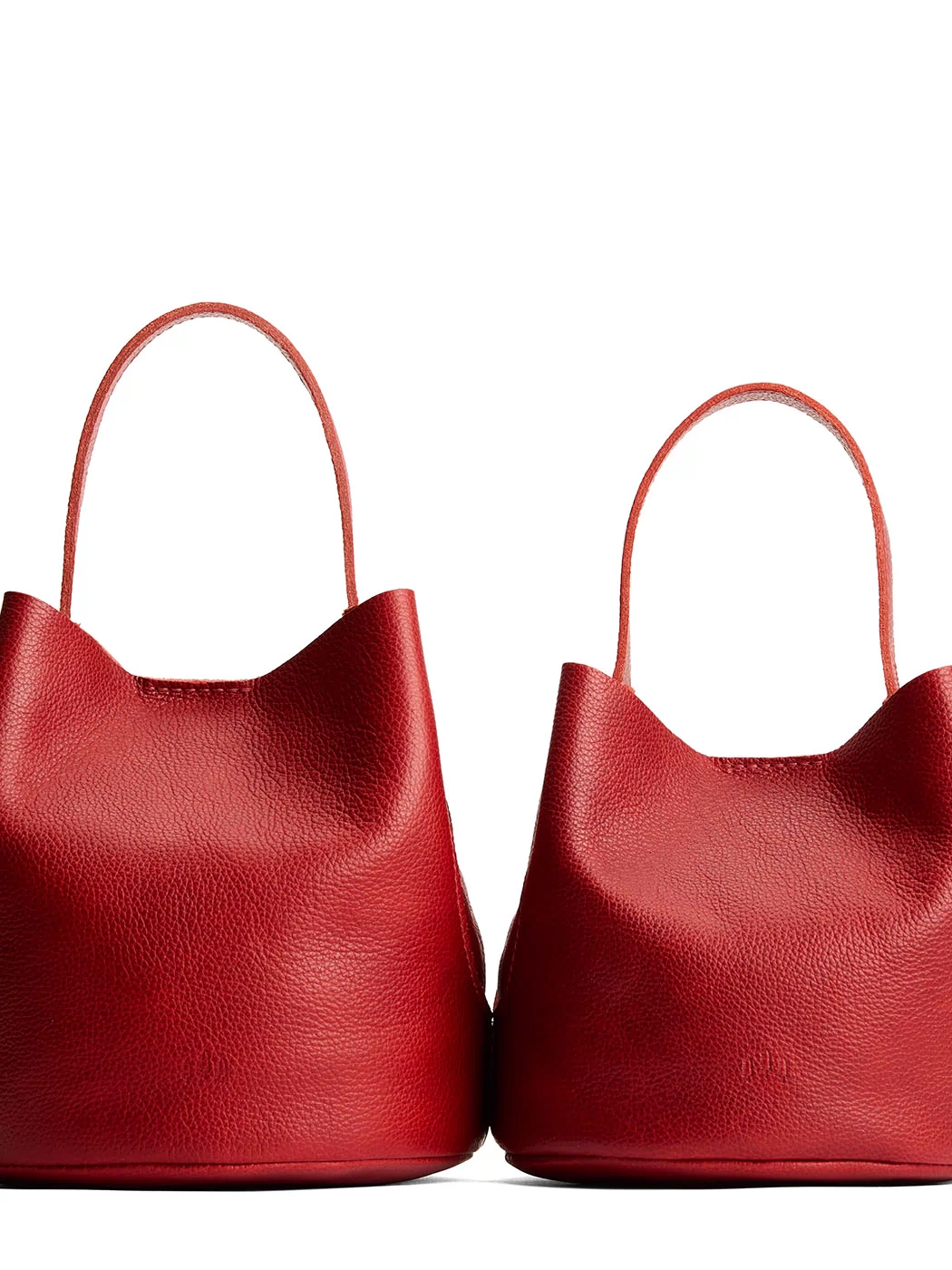 Chili Red | Size comparison image of two symmetrical leather bucket bags