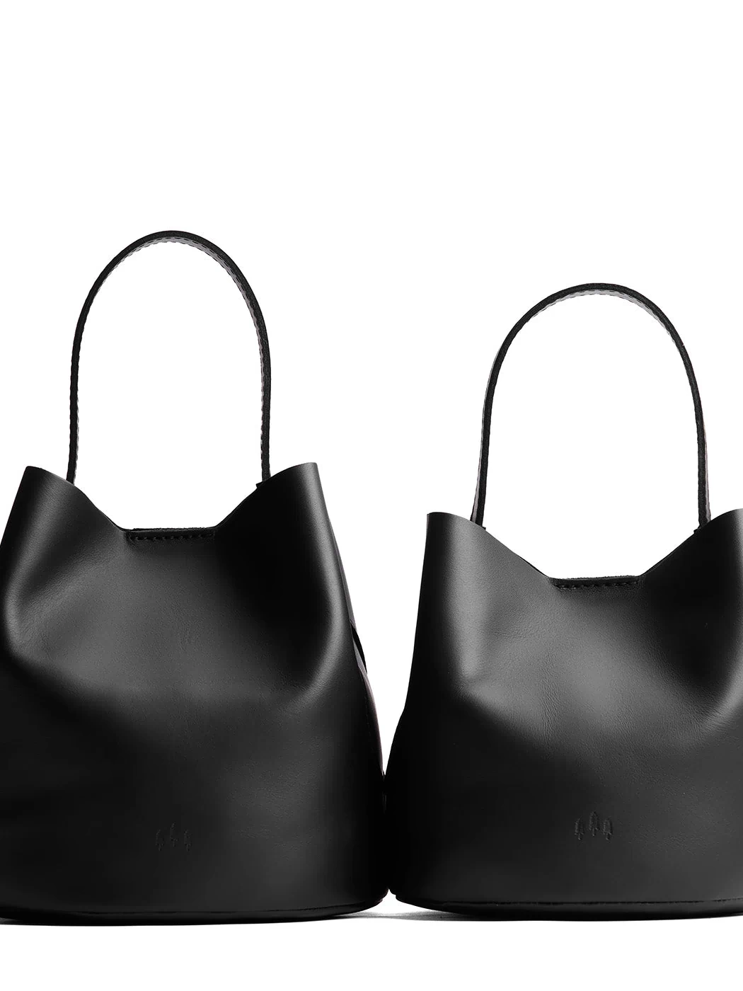 Black | Size comparison image of two symmetrical leather bucket bags