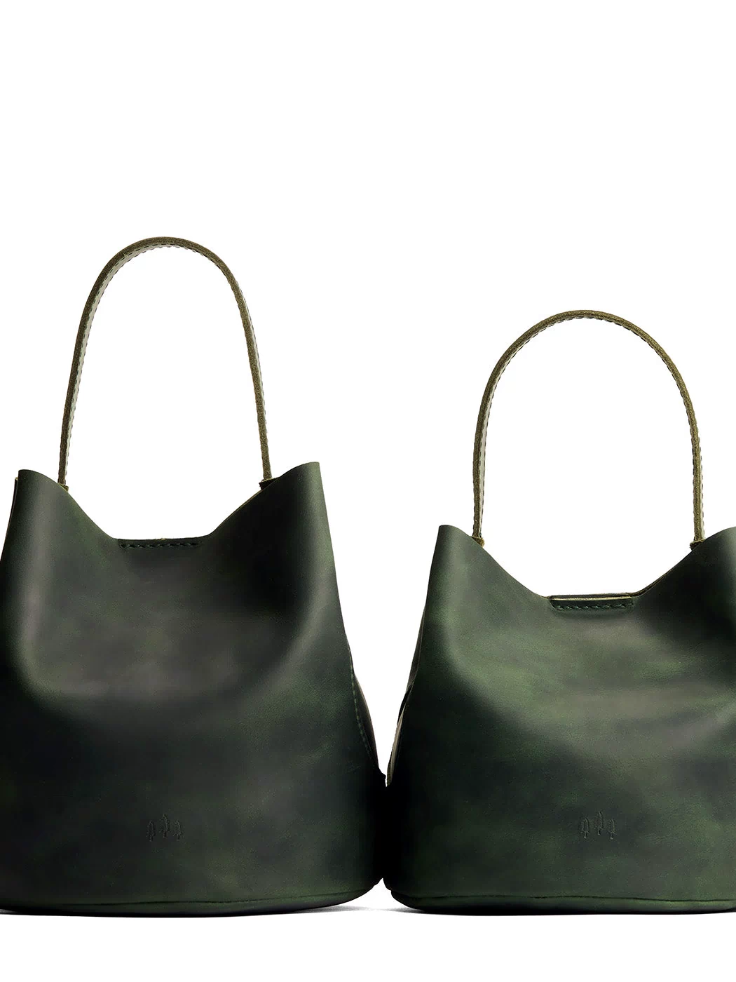 Evergreen | Size comparison image of two symmetrical leather bucket bags