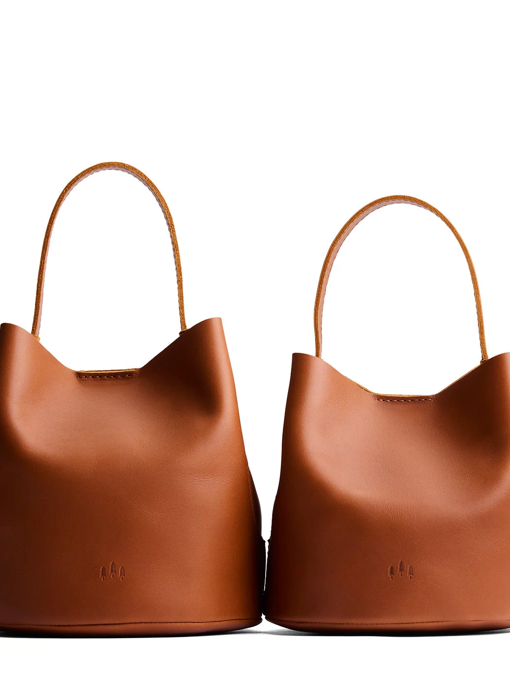Honey | Size comparison image of two symmetrical leather bucket bags