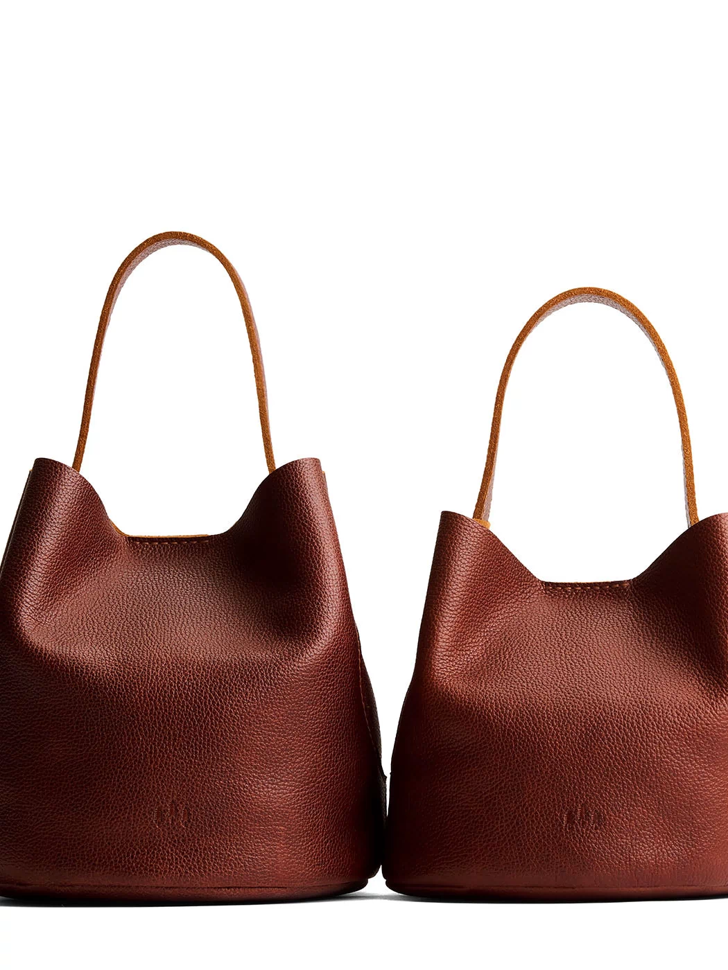 Nutmeg | Size comparison image of two symmetrical leather bucket bags