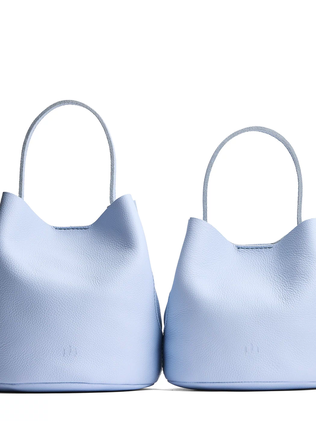 Skyway | Size comparison image of two symmetrical leather bucket bags