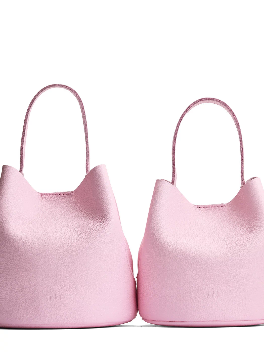 Pinkaboo | Size comparison image of two symmetrical leather bucket bags