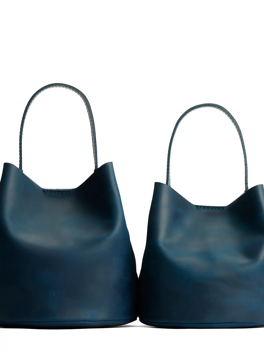 Westward Blue | Size comparison image of two symmetrical leather bucket bags