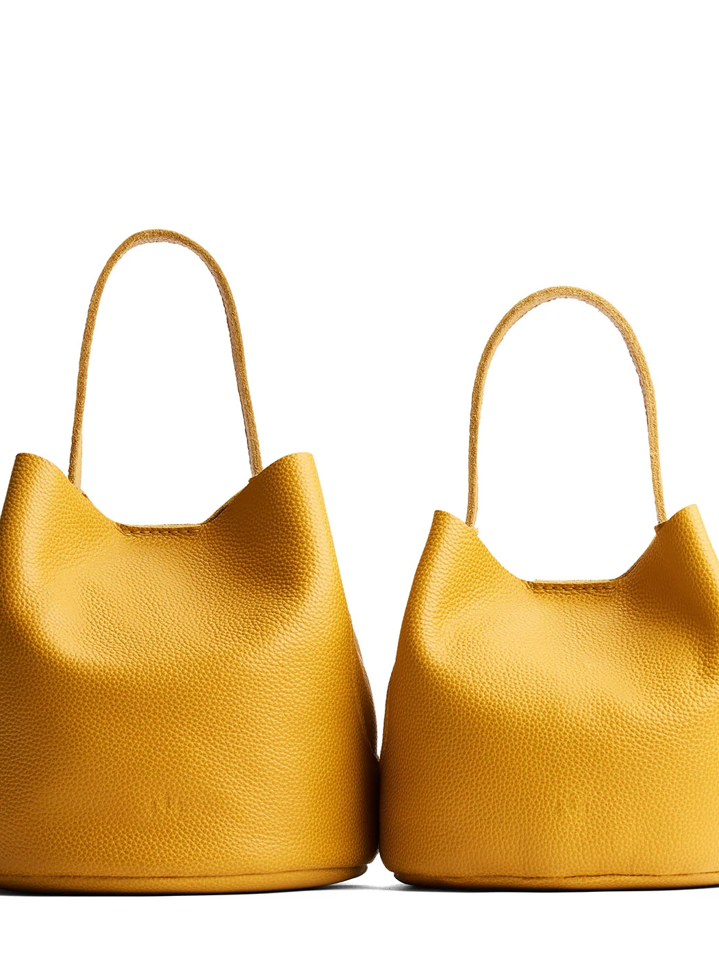 Sunshine | Size comparison image of two symmetrical leather bucket bags