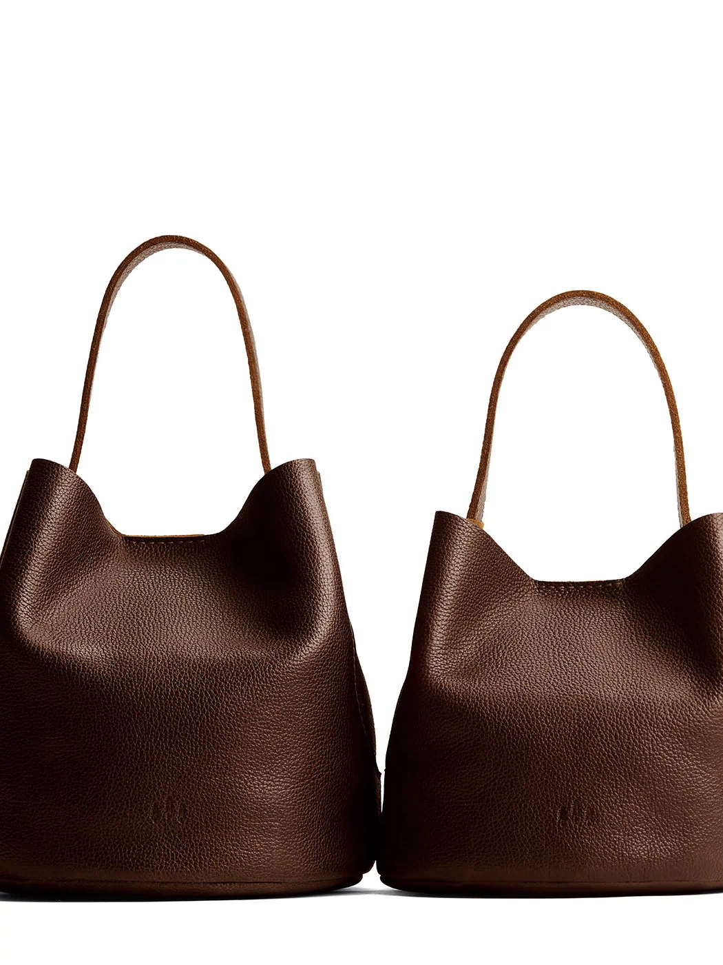 Coldbrew | Size comparison image of two symmetrical leather bucket bags