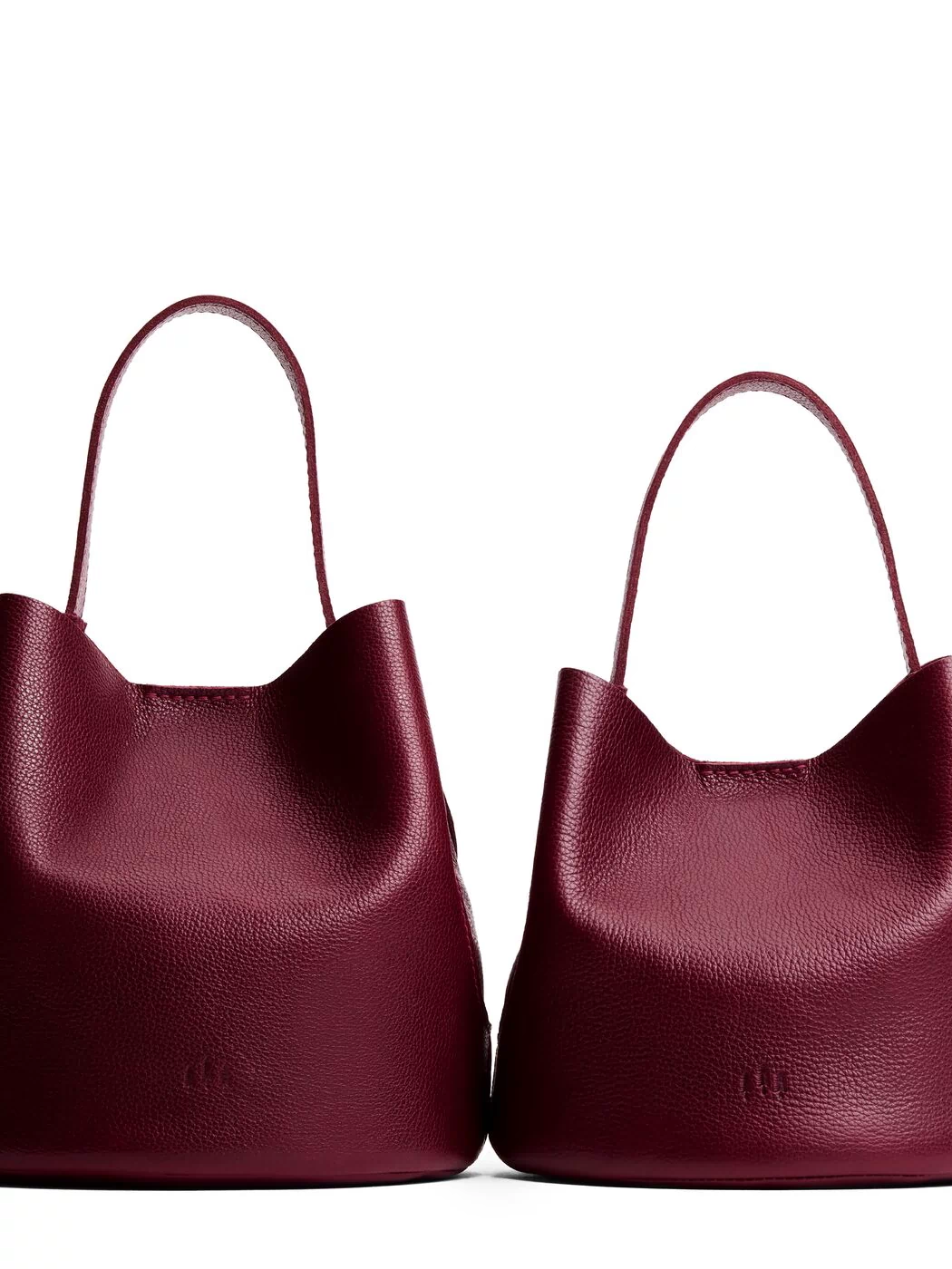 Cabernet | Size comparison image of two symmetrical leather bucket bags