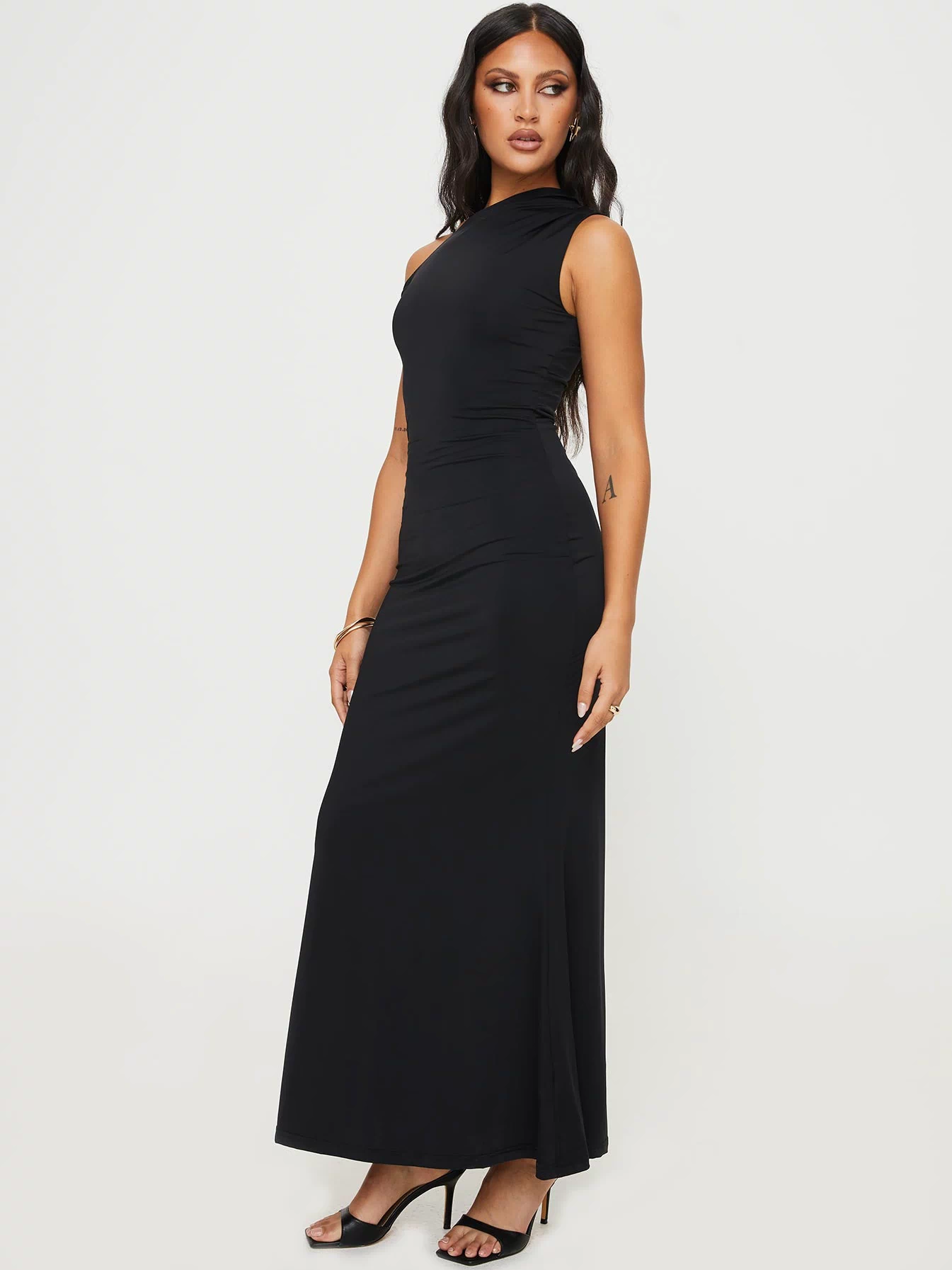 side view of model wearing Princess Polly Beller Maxi Dress Black Asymmetric Neckline 