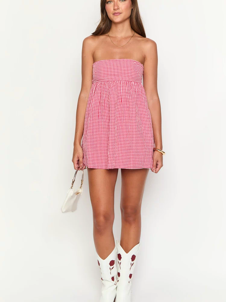 Front view of a red gingham strapless mini dress with a gathered bodice and a flowy A-line skirt