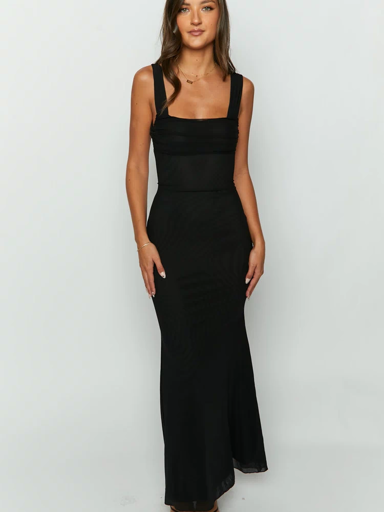 Black mesh maxi dress with a subtle textured pattern, square neckline, wide straps, and ruched bodice