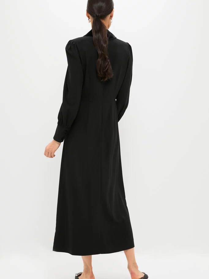 Black Long Sleeve Mariella Midi Dress exudes classic, effortless elegance with velvet trim, blouson sleeves, and side gather, paired with chic, open-back mules.