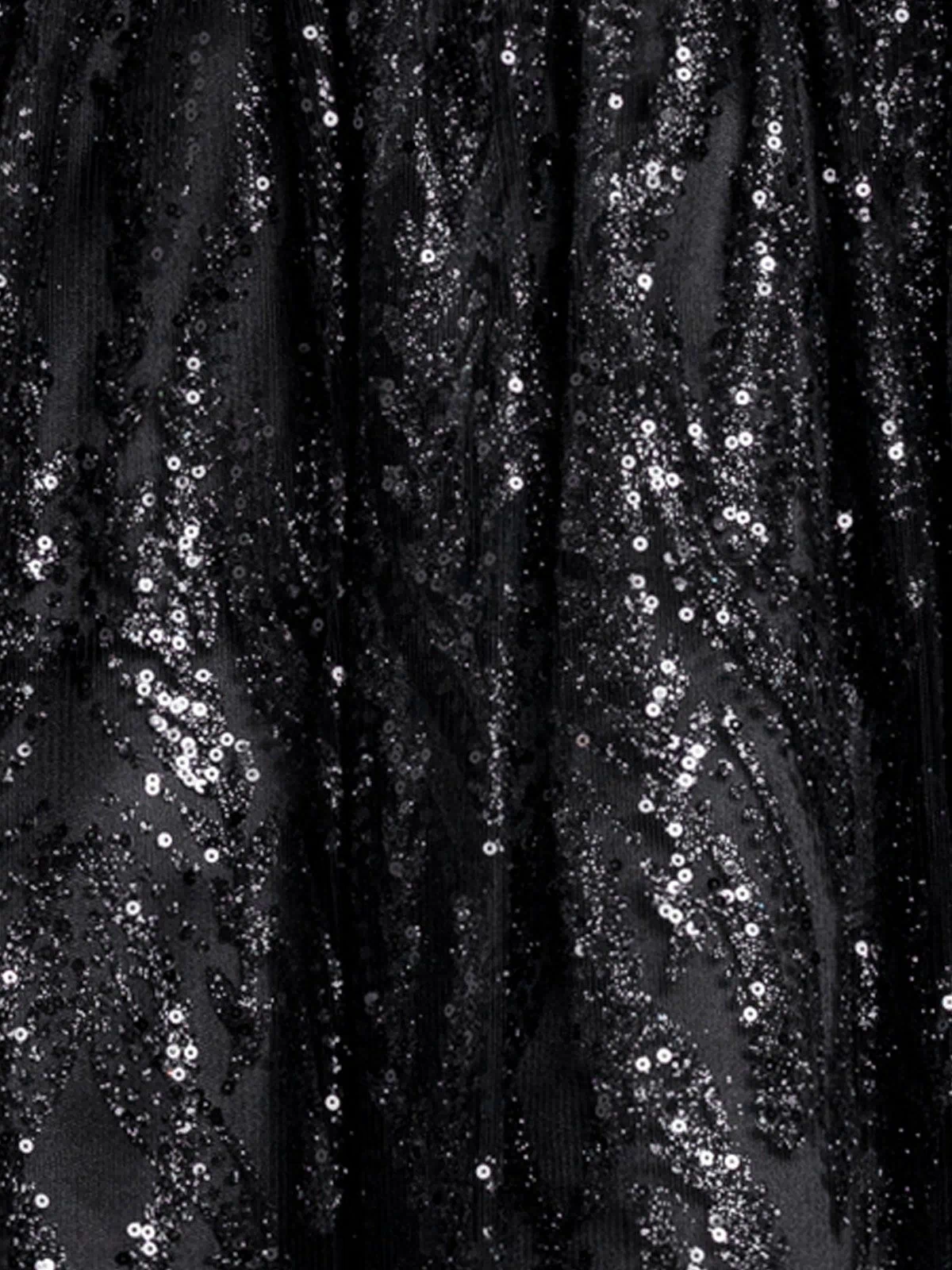 Close-up of black fabric from the Mini Black Beaded Hoco Dress: Blondie Nites 6306BN, featuring shiny sequins in swirling patterns.