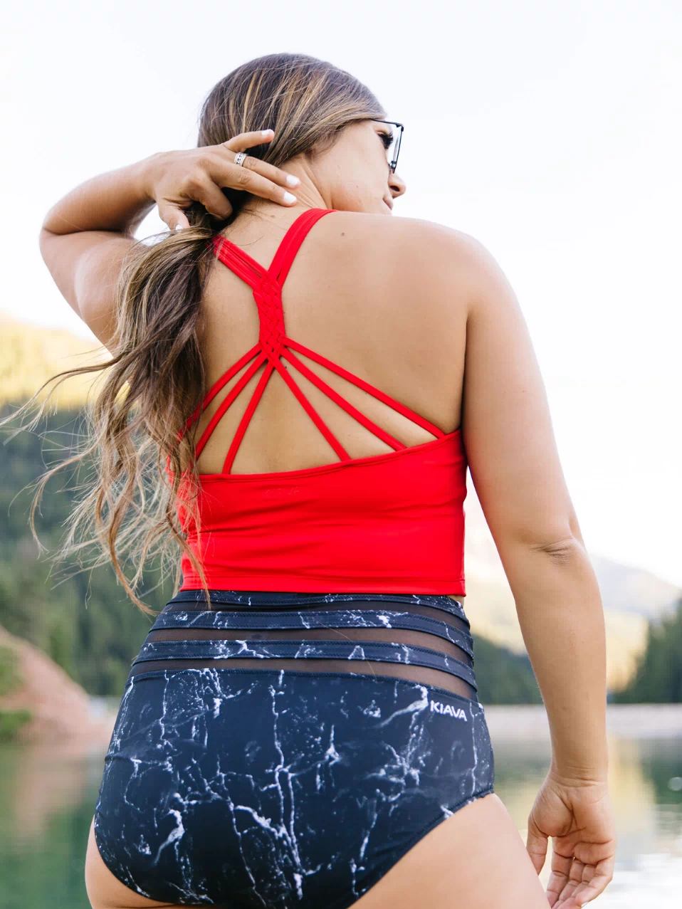 Olivia is wearing large bottoms & a medium top. She is a size 10, 5'8" and a 34D.