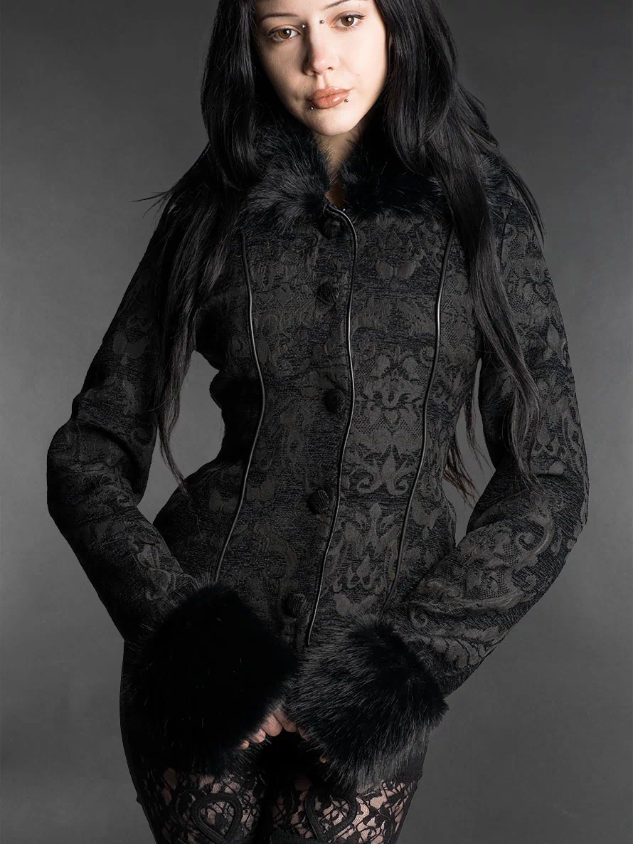 Black gothic brocade jacket with faux fur cuffs, fitted silhouette and high collar worn by a model