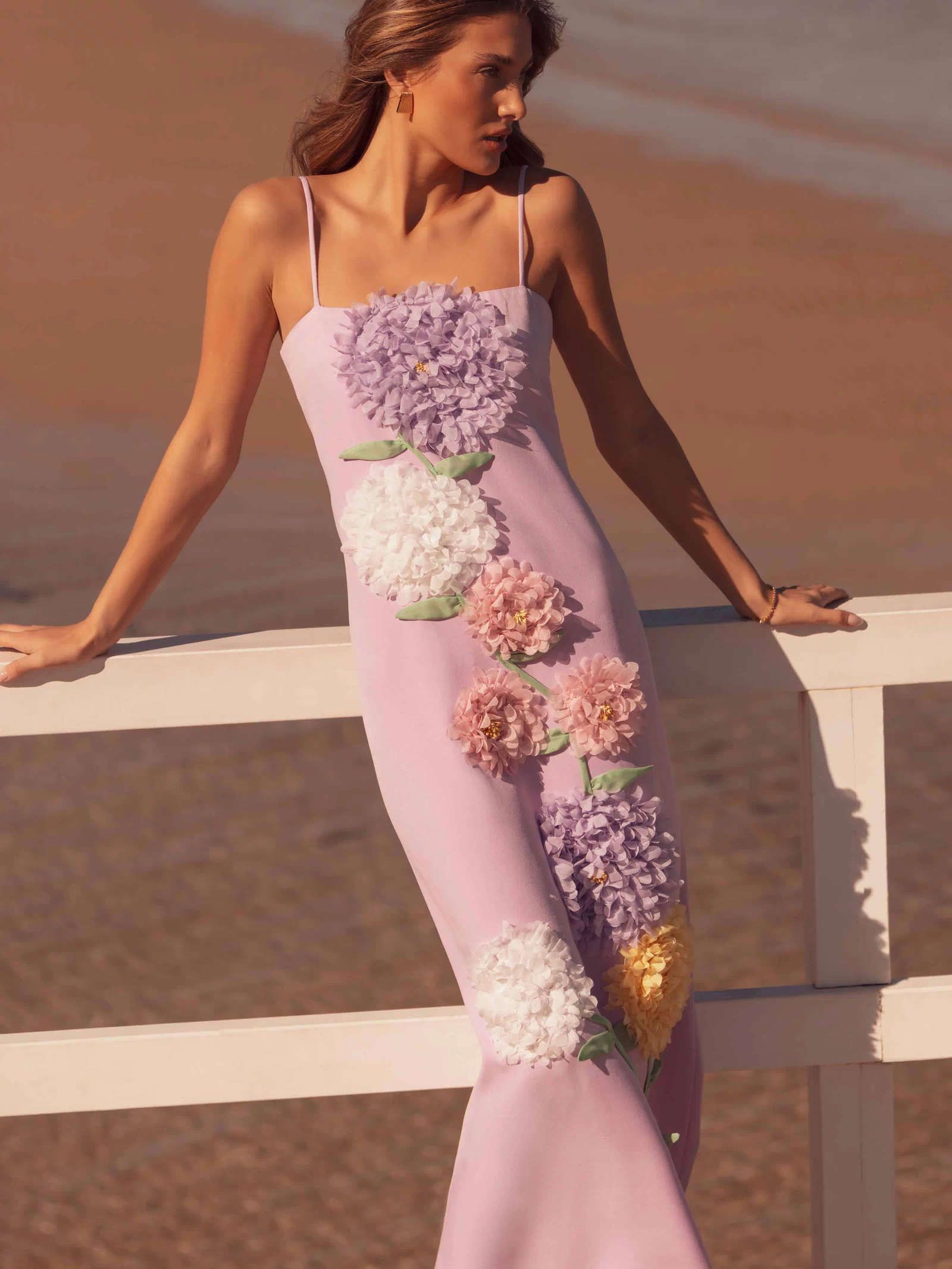 Brunette model wearing Buttercup Embroidered Maxi Dress in Purple front shot