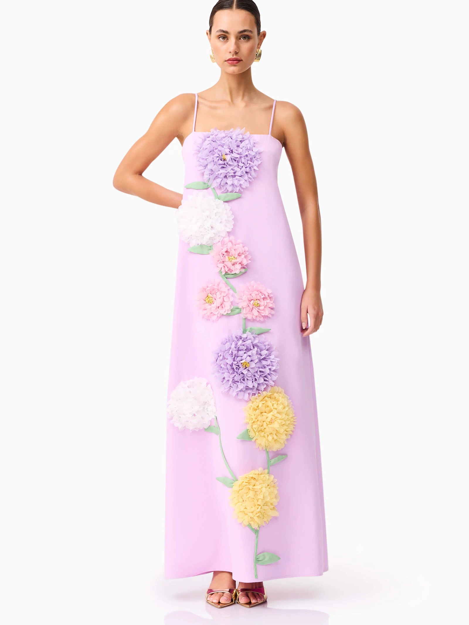 Brunette model wearing Buttercup Embroidered Maxi Dress in Purple posed hand on hip shot