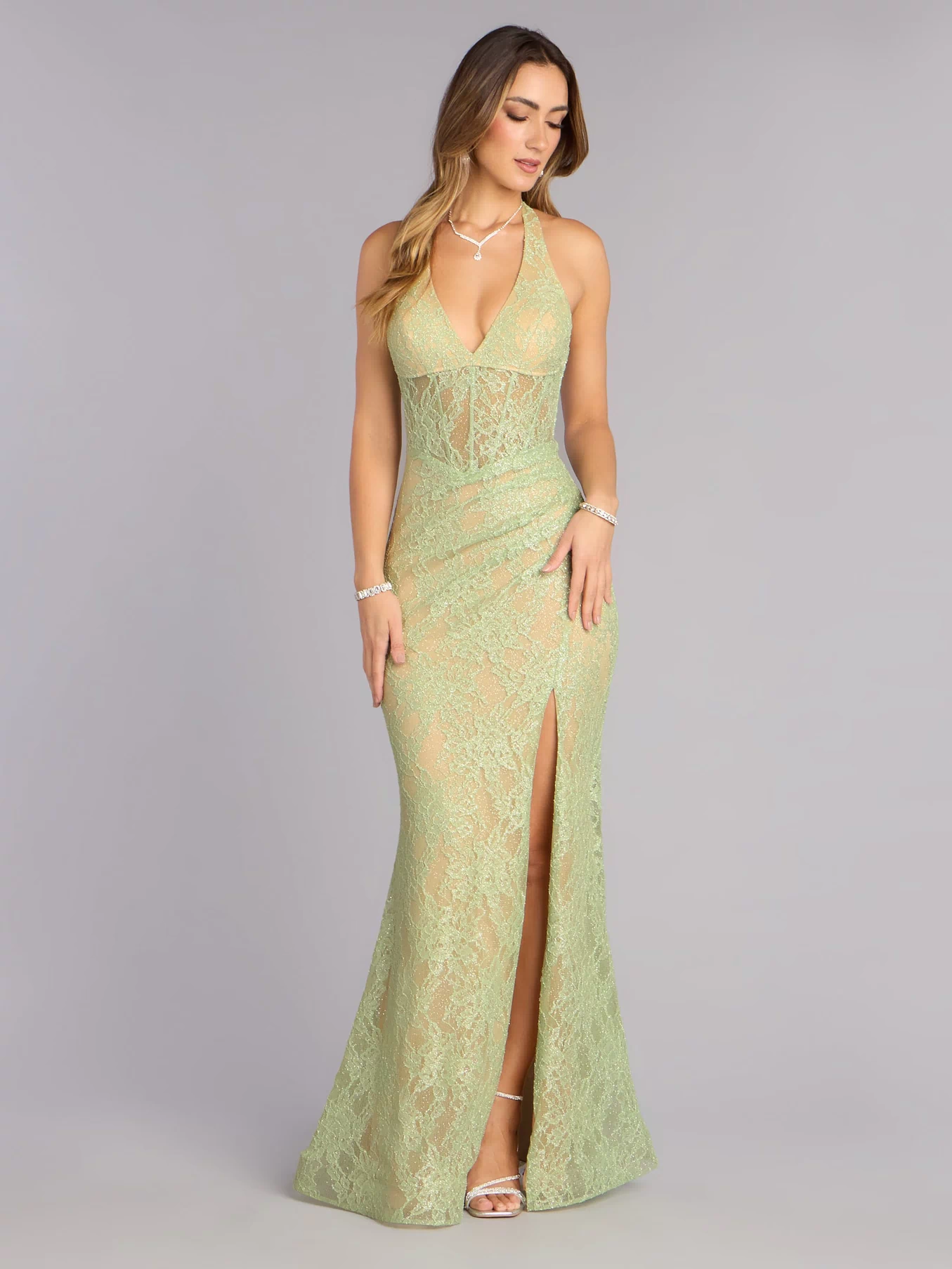 Discover a formal dress like the Cadie Halter Corset Slit Lace Formal Dress in sage green featuring a flattering fit, smooth fabric, and refined design for any formal occasion.