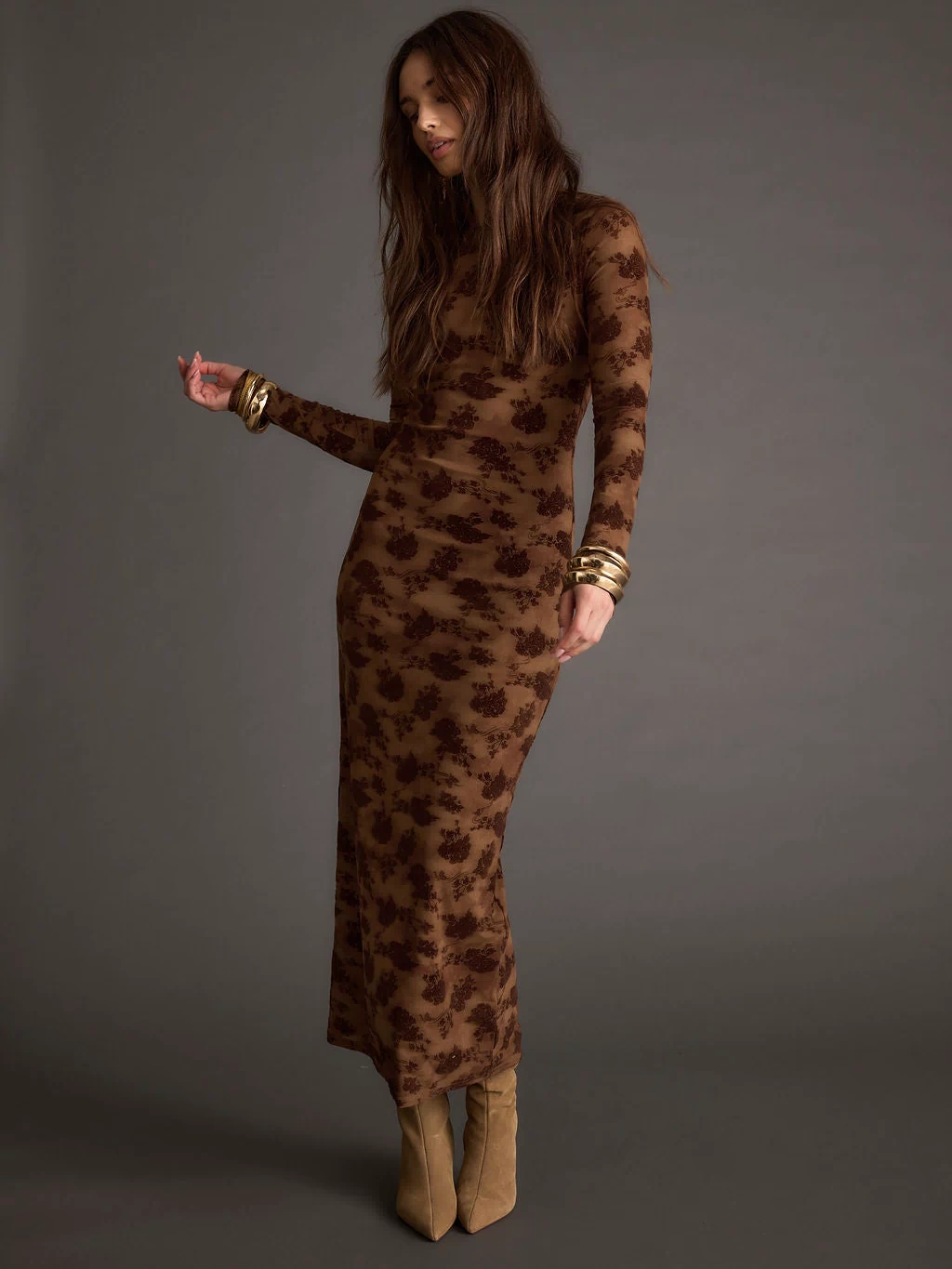 Close-up of the Casanova Brown Floral Maxi Dress showcasing the fabric texture and design details.