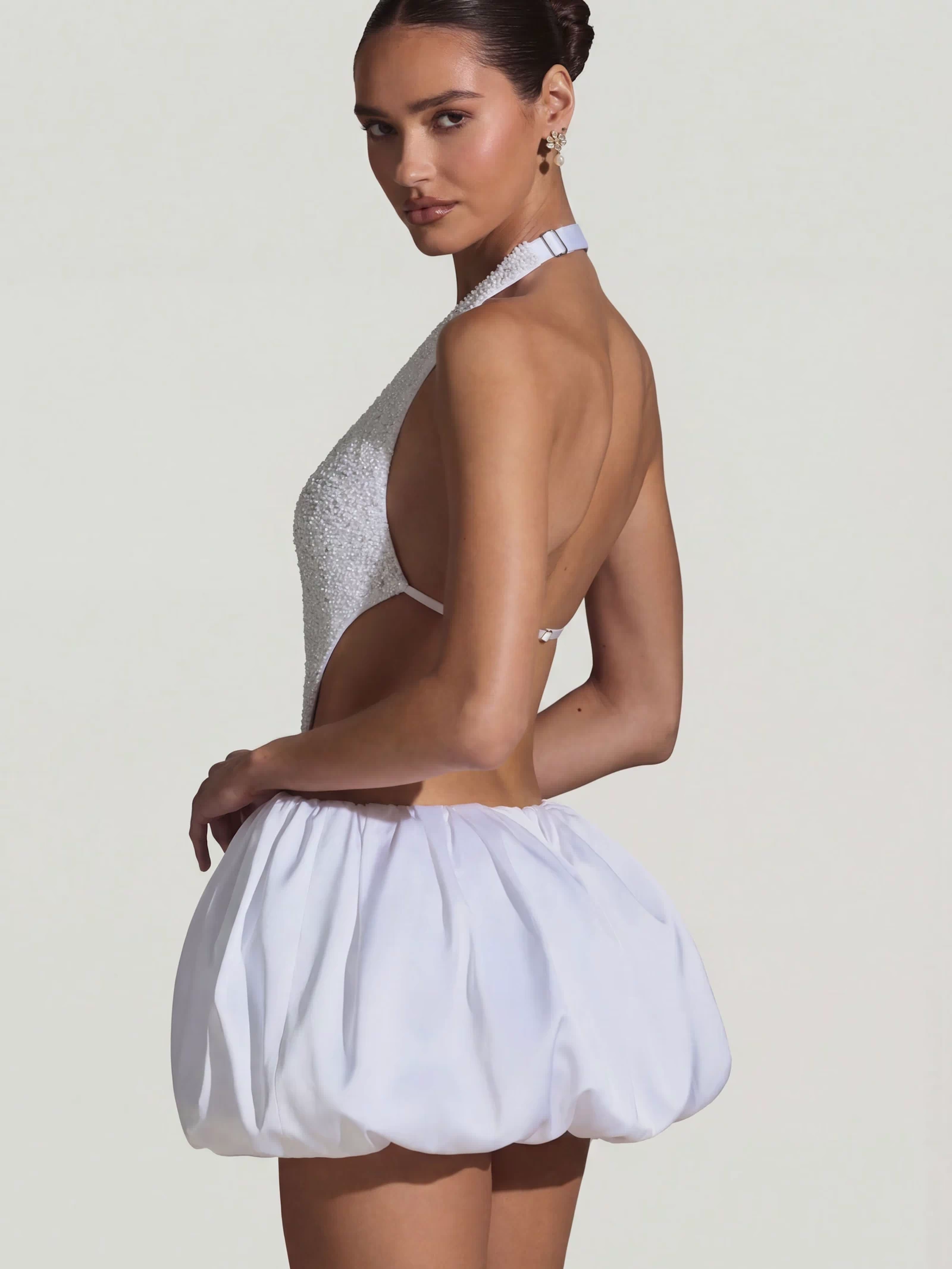 Oh Polly's Anna wearing the Cece Mini Dress in White Embellished, Recycled Satin fabric perfect for cocktail evenings