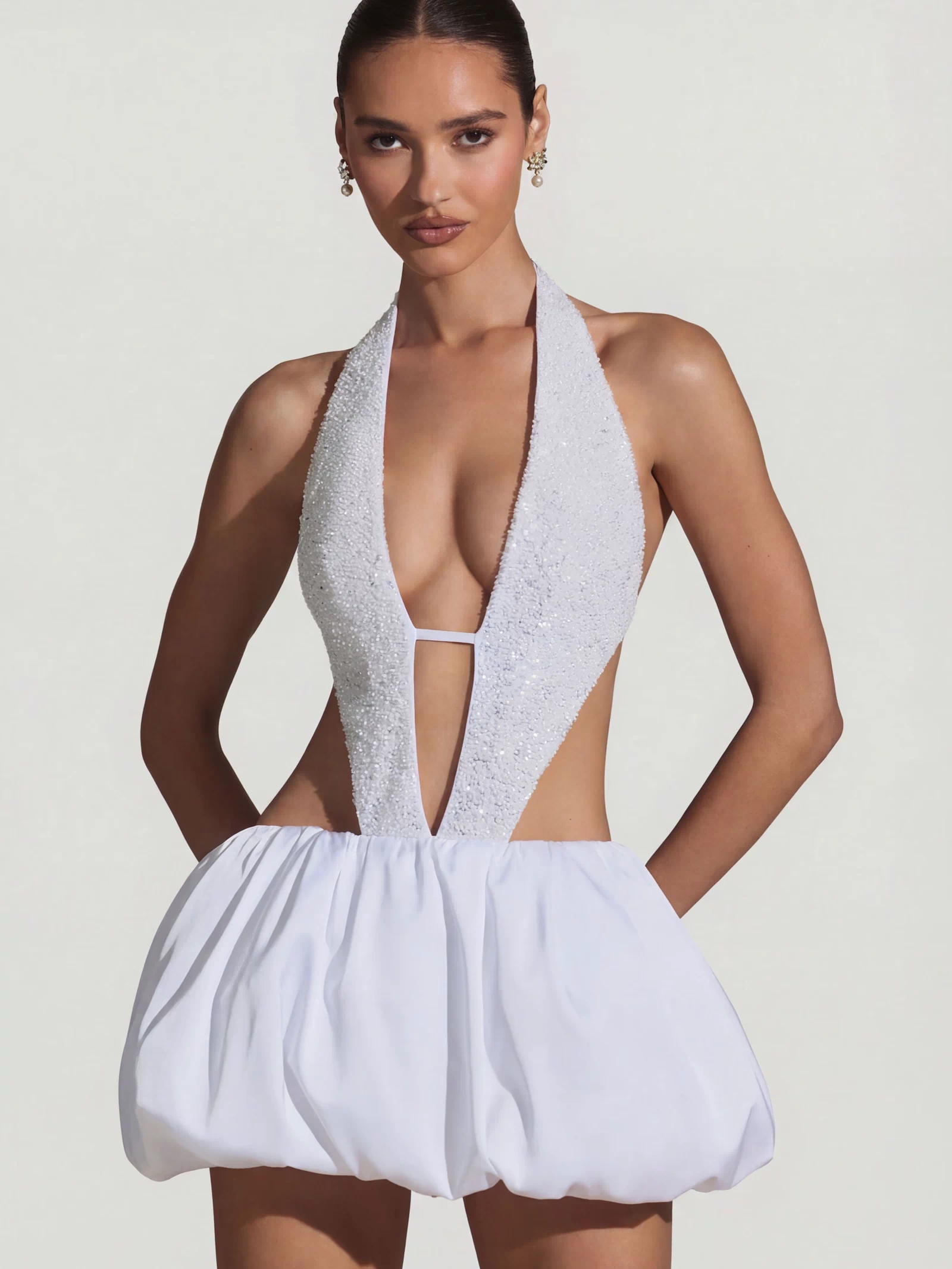 Oh Polly's Anna wearing the Cece Mini Dress in White Embellished, Recycled Satin fabric perfect for engagement dinners