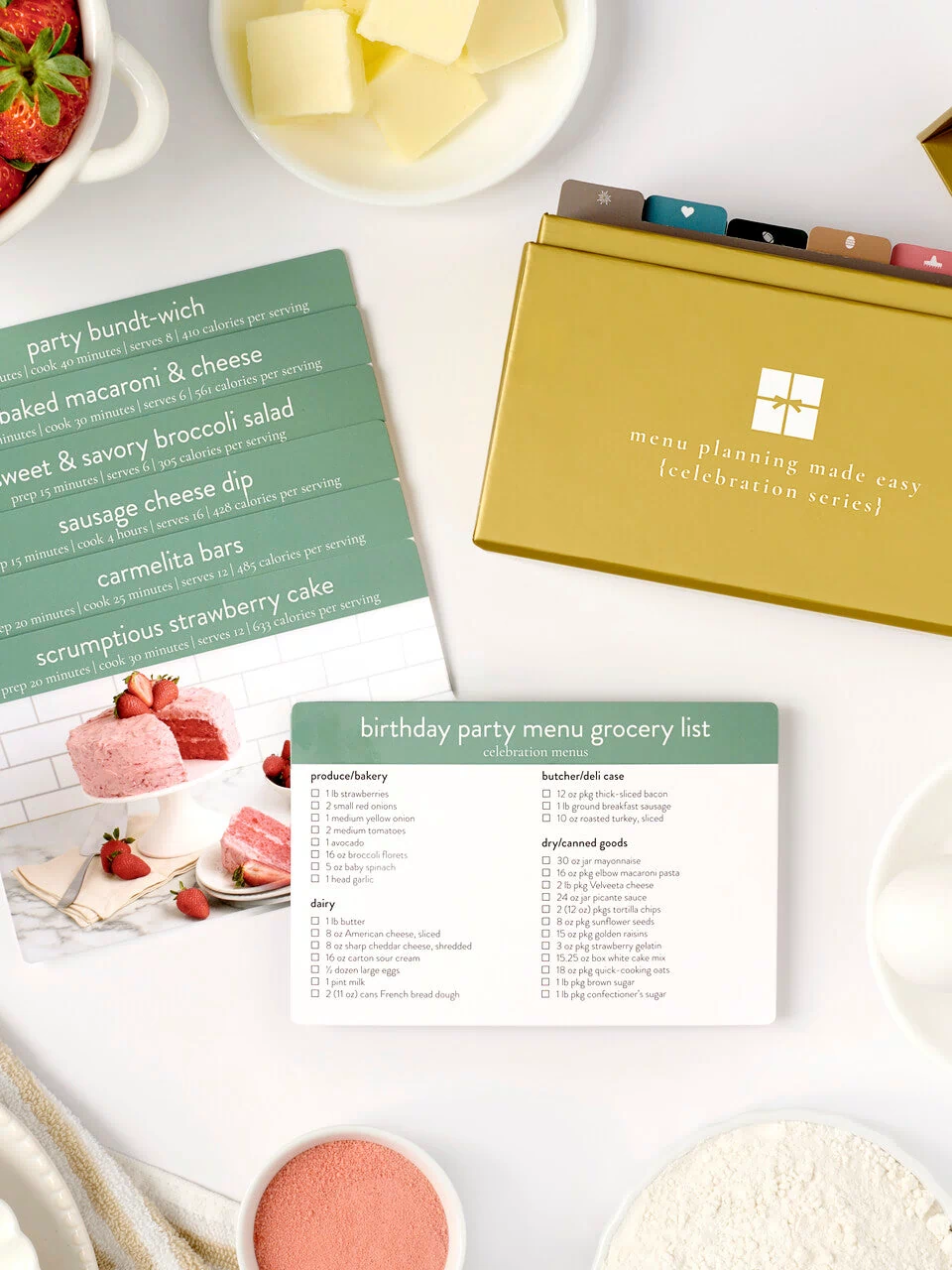 celebration menu box with photos and cards laid out 2