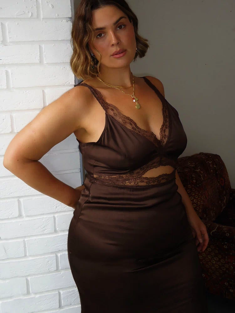 Chocolate satin Mimi Dress with lace trims and an under-bust cutout, highlighting inclusive sizing.