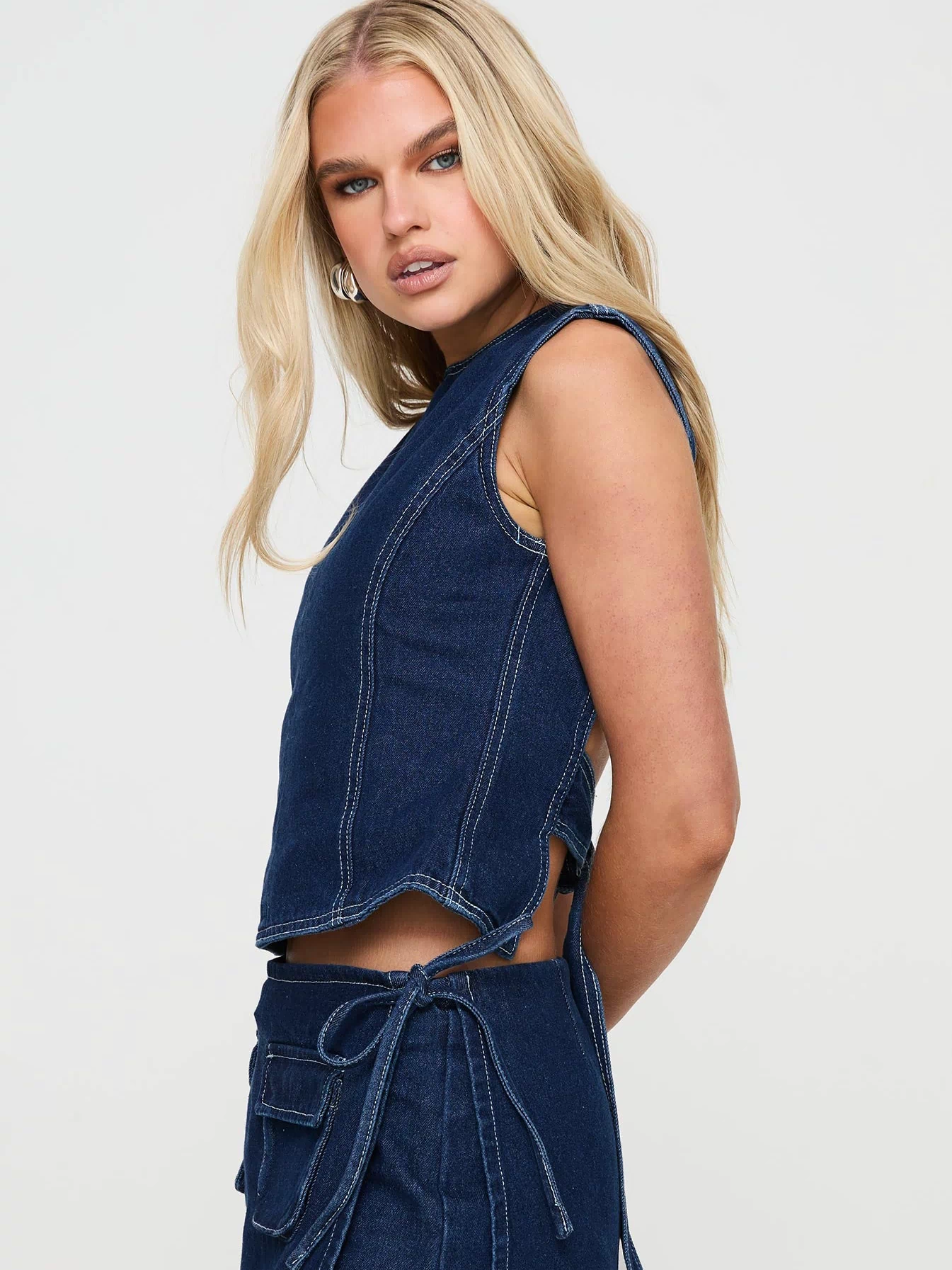 side view of model wearing Princess Polly Countryside Top Denim Sleeveless Crew Neck 