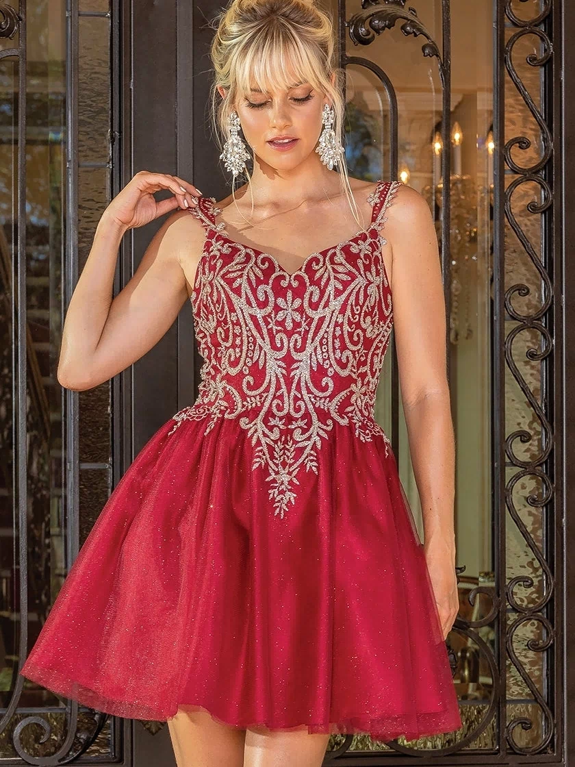 A woman wearing the Embroidered-Bodice Short Glitter Hoco Dress 3295, a red sleeveless party dress with silver embroidery, stands before ornate black doors.