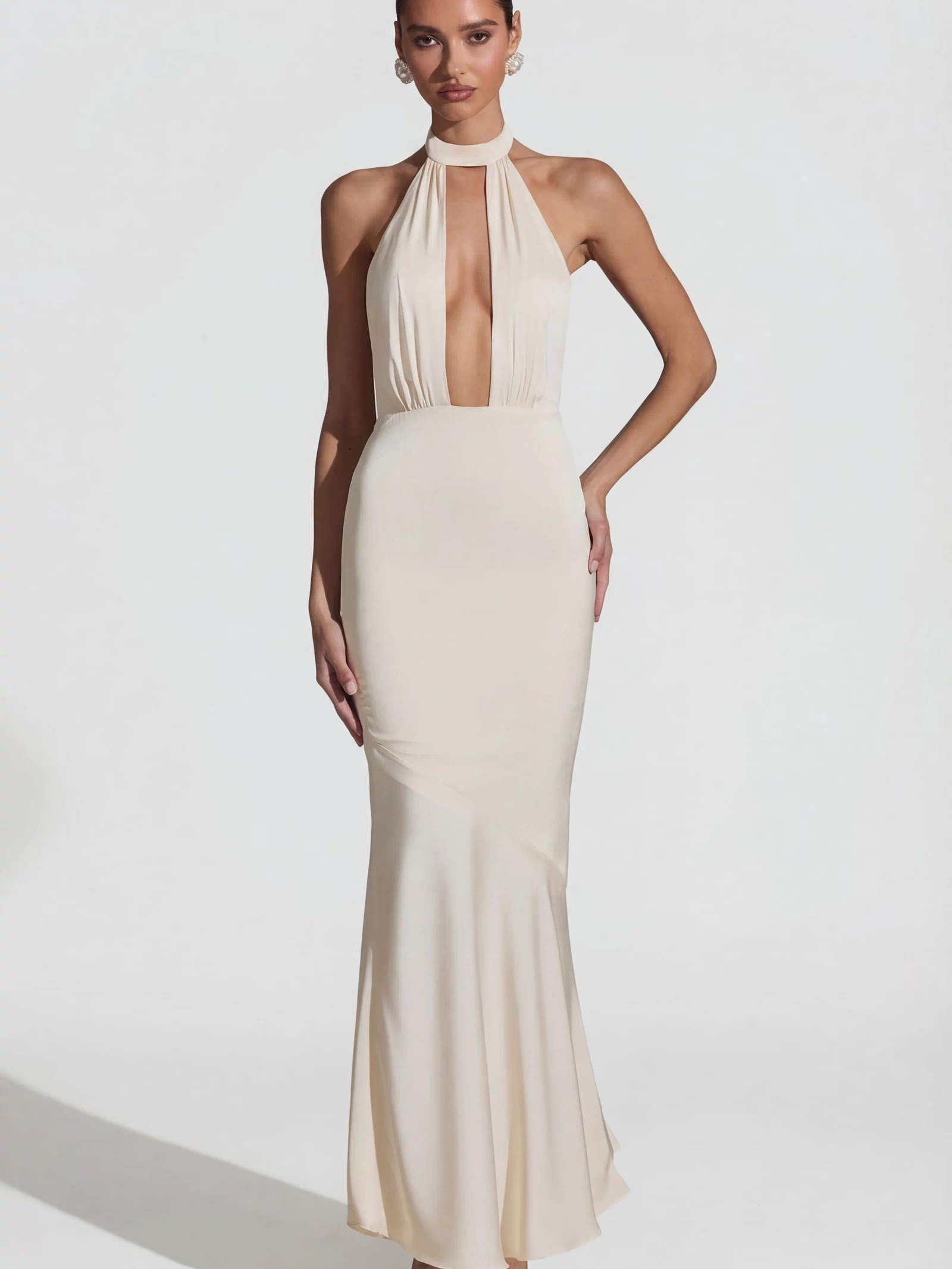 Oh Polly's Priscilla wearing the Desiree Gown Length Dress in Ivory Satin fabric perfect for chic cocktail soirees