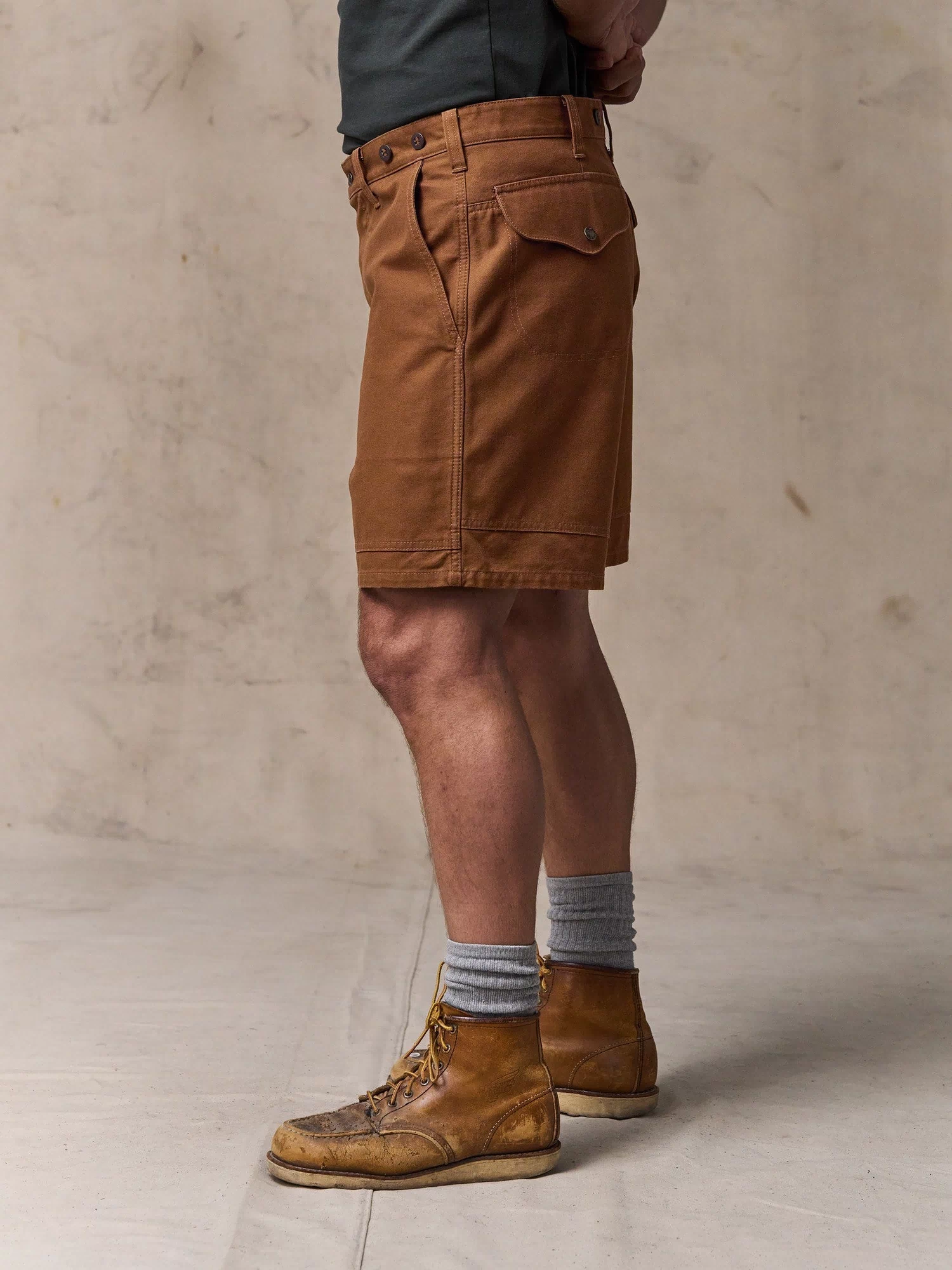 image of a model wearing Filson's Dry Tin Cloth Shorts  - Whiskey