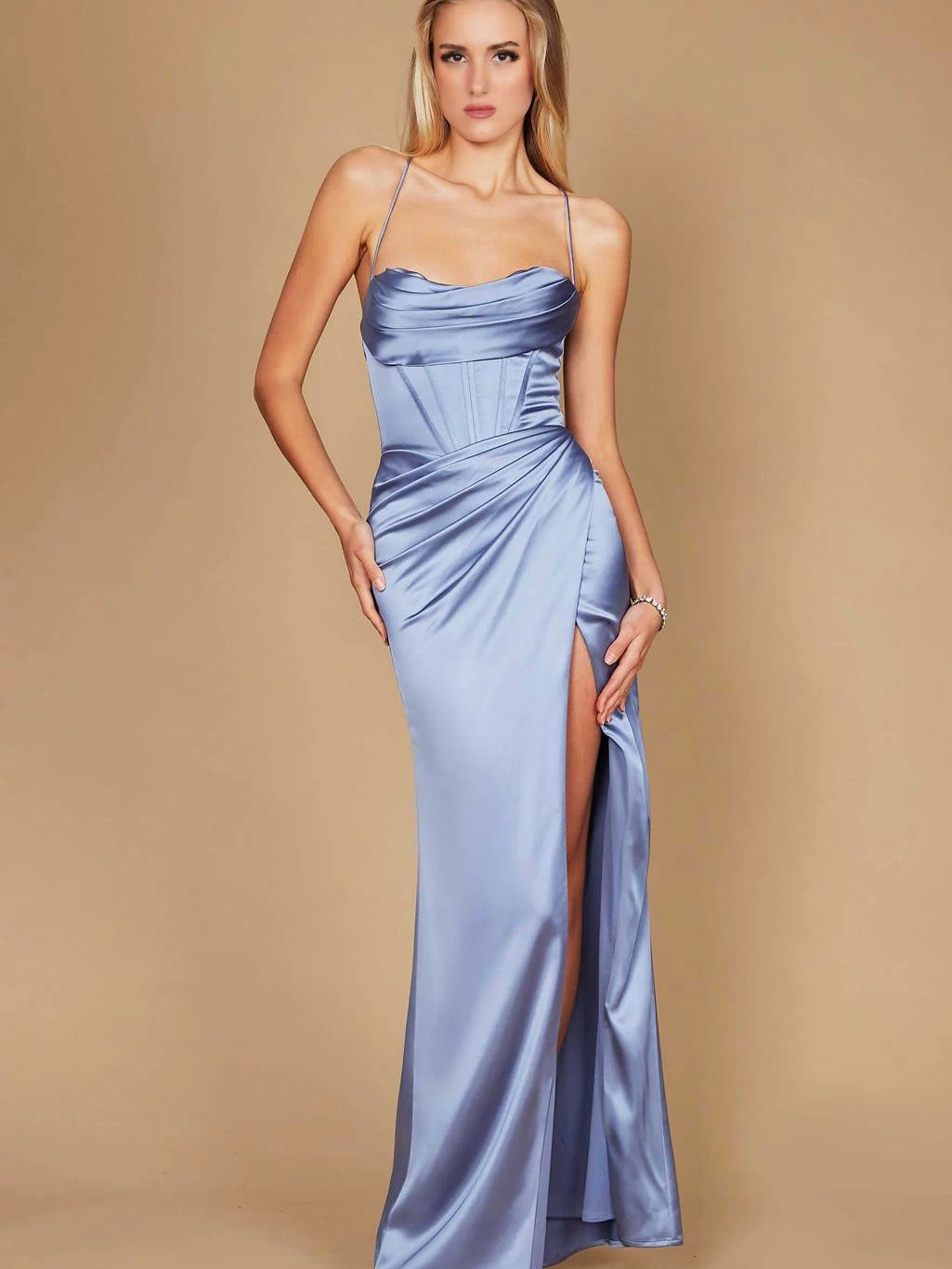 A stunning periwinkle blue long prom dress featuring a draped corset design and elegant cowl neckline, perfect for a formal evening event.