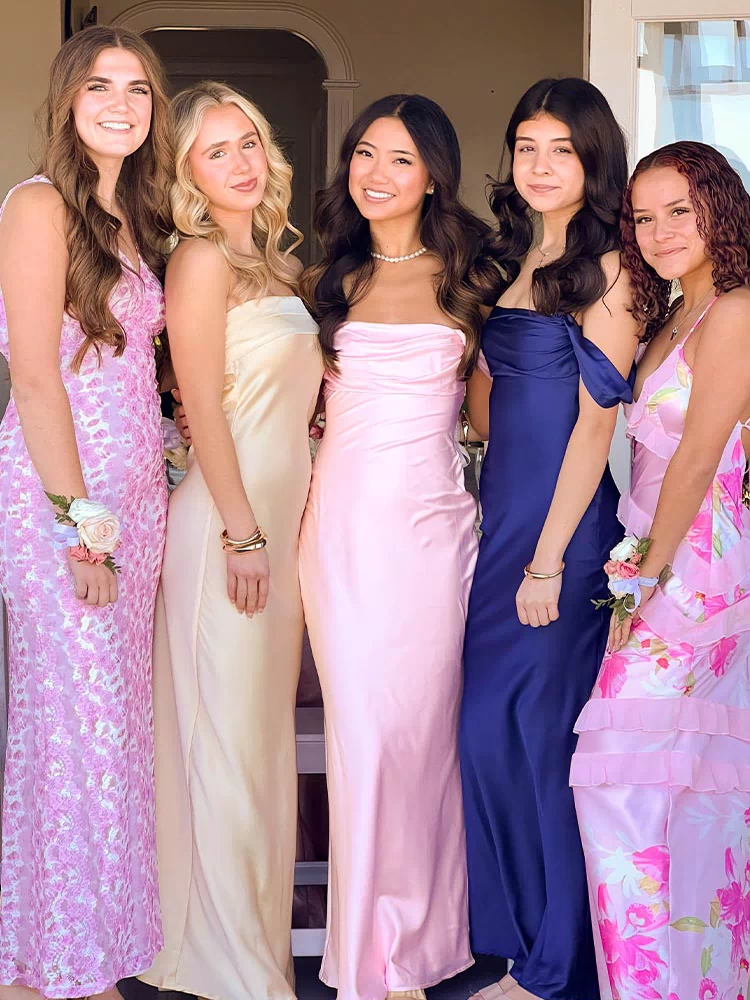 Light pink satin off-shoulder maxi dress with a ruched bodice and fitted silhouette