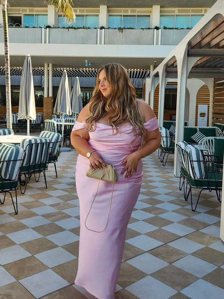 Light pink off-shoulder maxi dress with a ruched sweetheart neckline and fitted silhouette