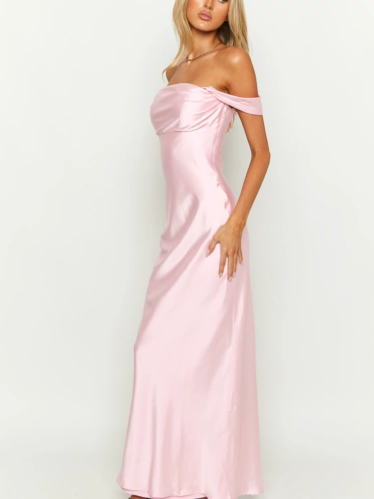 Side view of a light pink off-shoulder maxi dress with a draped neckline and flowing satin skirt