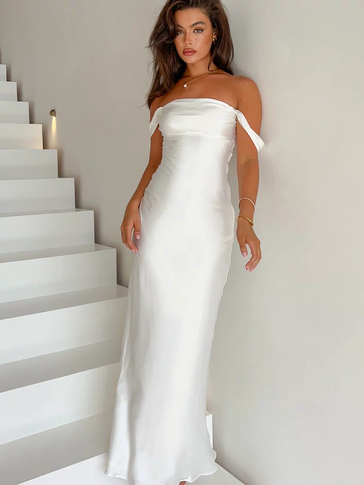 Full length view of a white off-shoulder satin formal dress with a fitted bodice and flowing maxi skirt