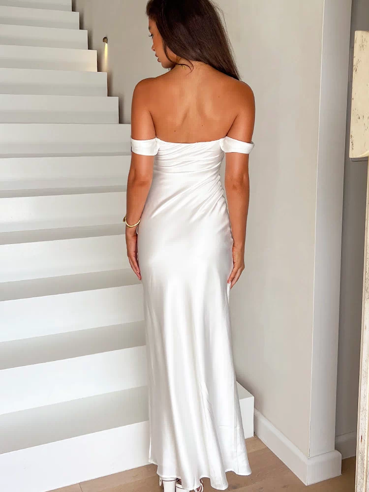 Rear view of a white satin off-shoulder maxi dress with a ruched side detail