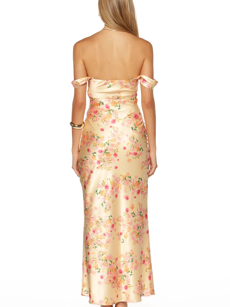 Rear view of a yellow satin off-shoulder maxi dress with a pink and orange floral print