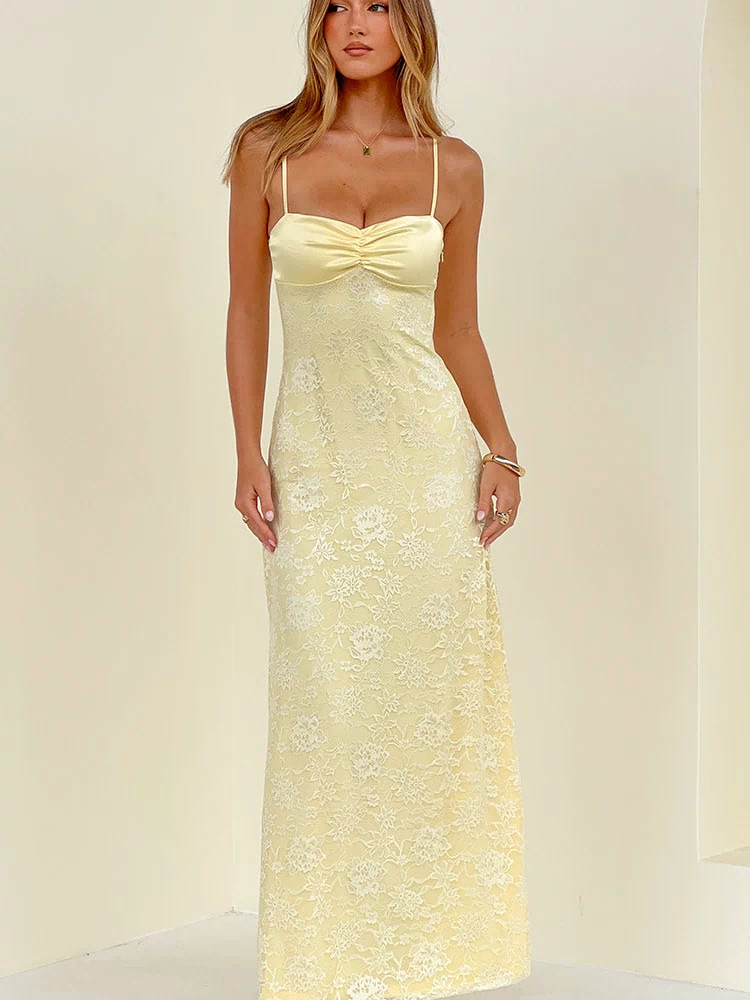 Front view of a yellow floral lace maxi dress with spaghetti straps and a ruched bust