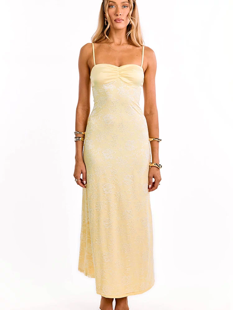 Full length front view of a yellow lace maxi dress with spaghetti straps and a ruched bust