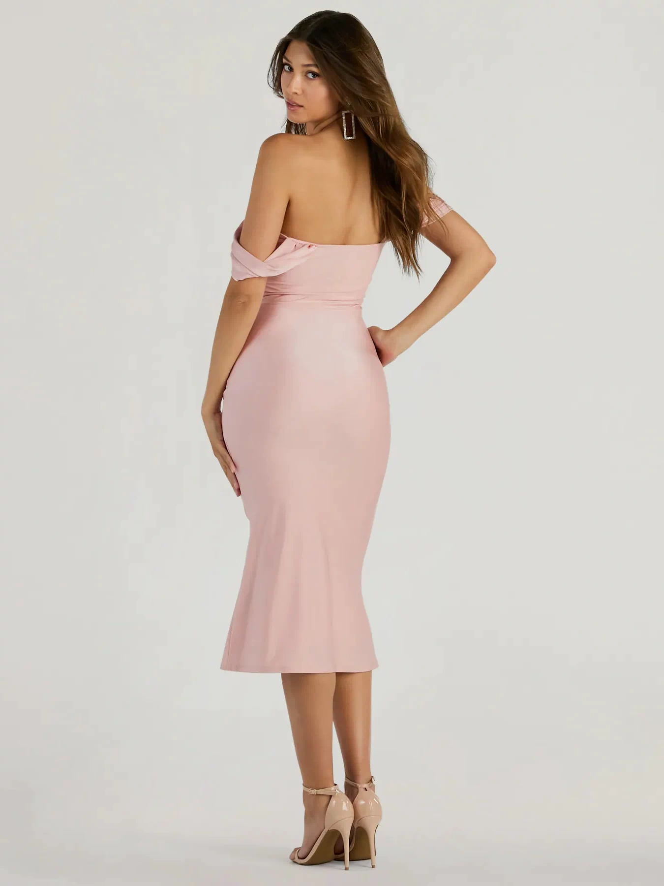 The Exceptional Off-The-Shoulder Flared Midi Dress is a pink midi dress, featuring an elevated midi-length silhouette perfect for wedding guest attire, romantic date nights, or effortless everyday styling.