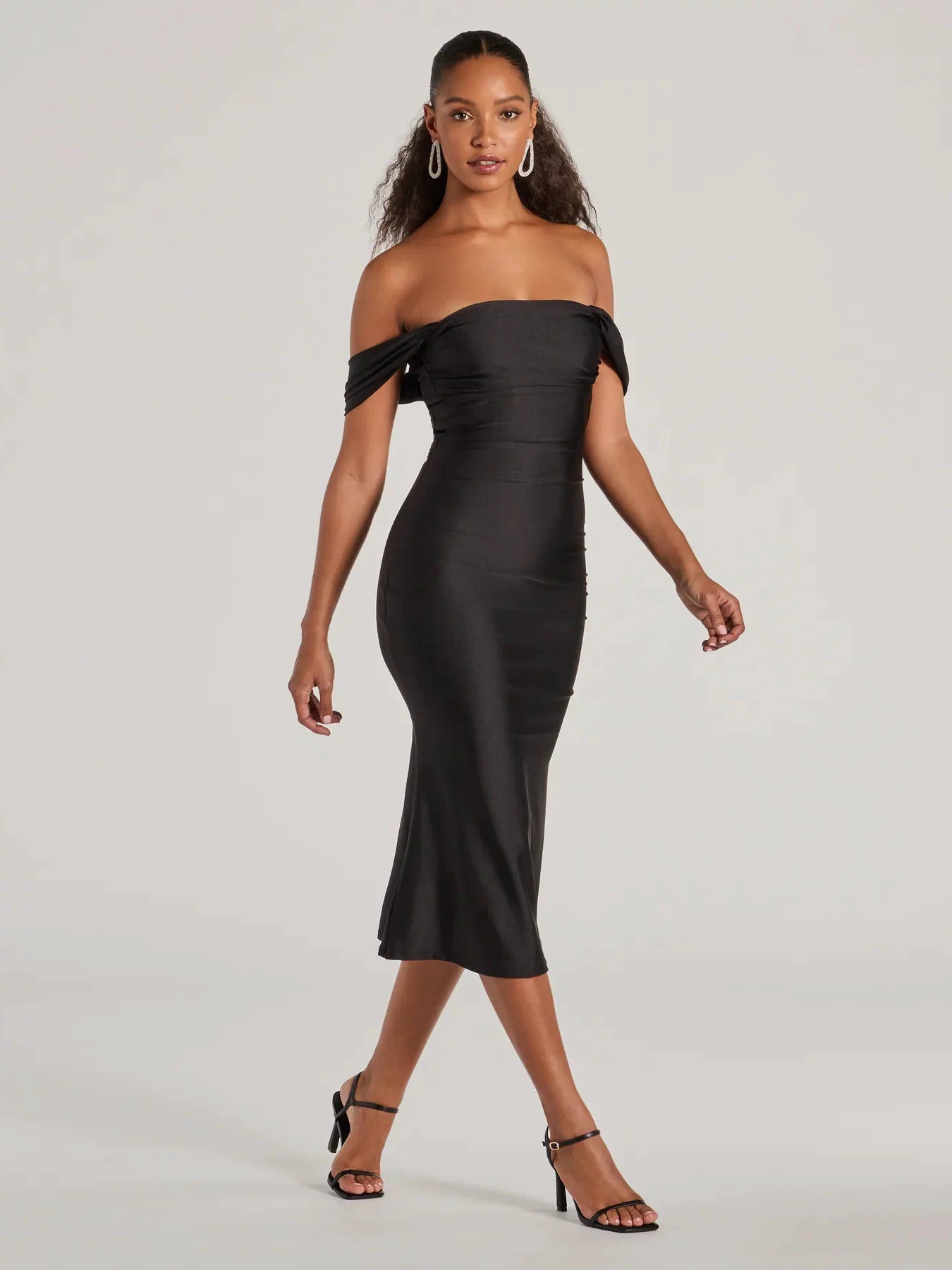 The Exceptional Off-The-Shoulder Flared Midi Dress is your new go-to black dress—effortless, versatile, and made to update your spring or summer style in seconds.